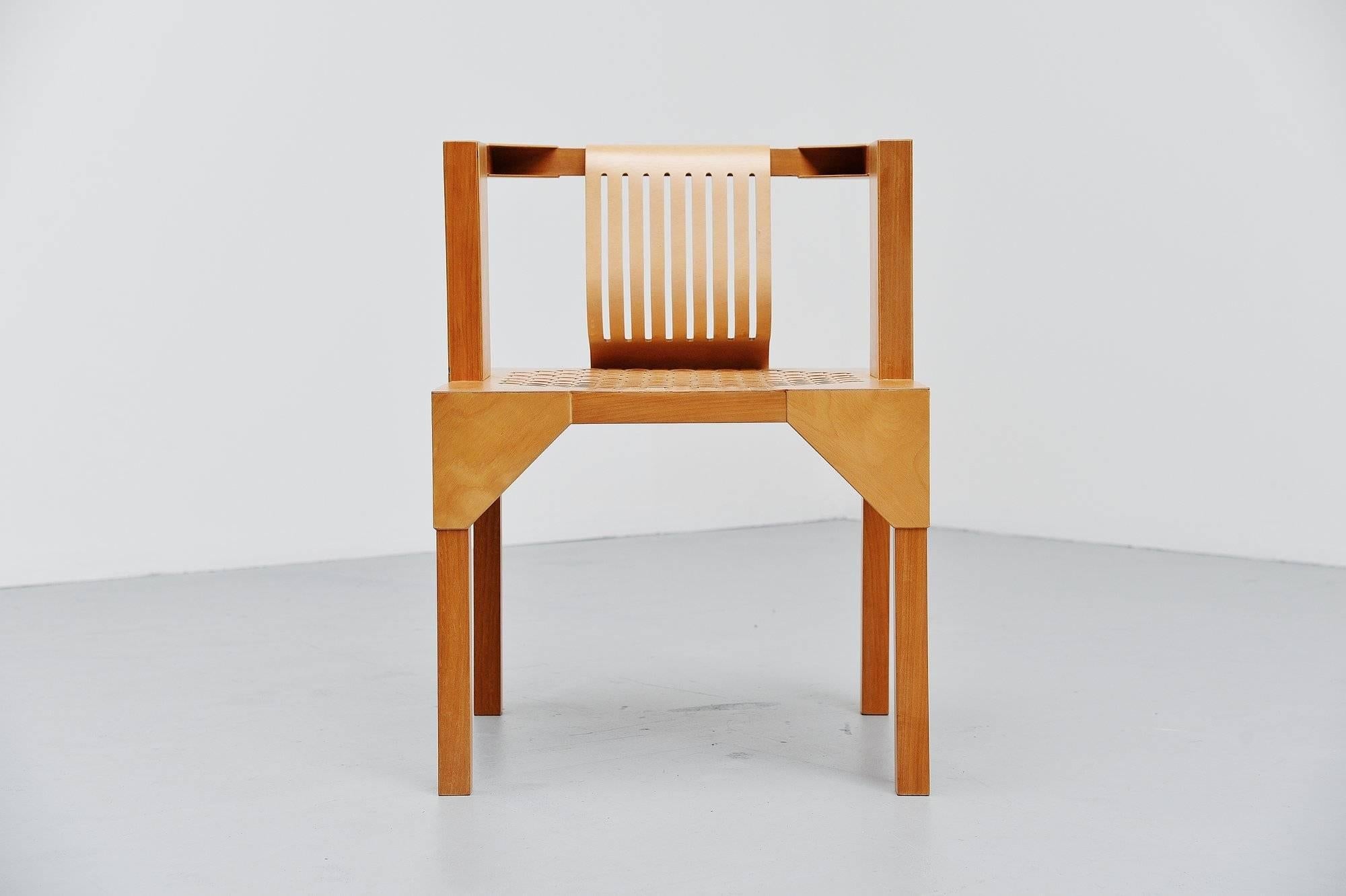 Very nice modernist armchair designed by Ruud Jan Kokke, manufatured by Kokke, Holland, 1986. This chair is made of birch plywood and solid birch legs. It has a very nice woven seat and plywood back. Kokke was well known for its artistic birch and