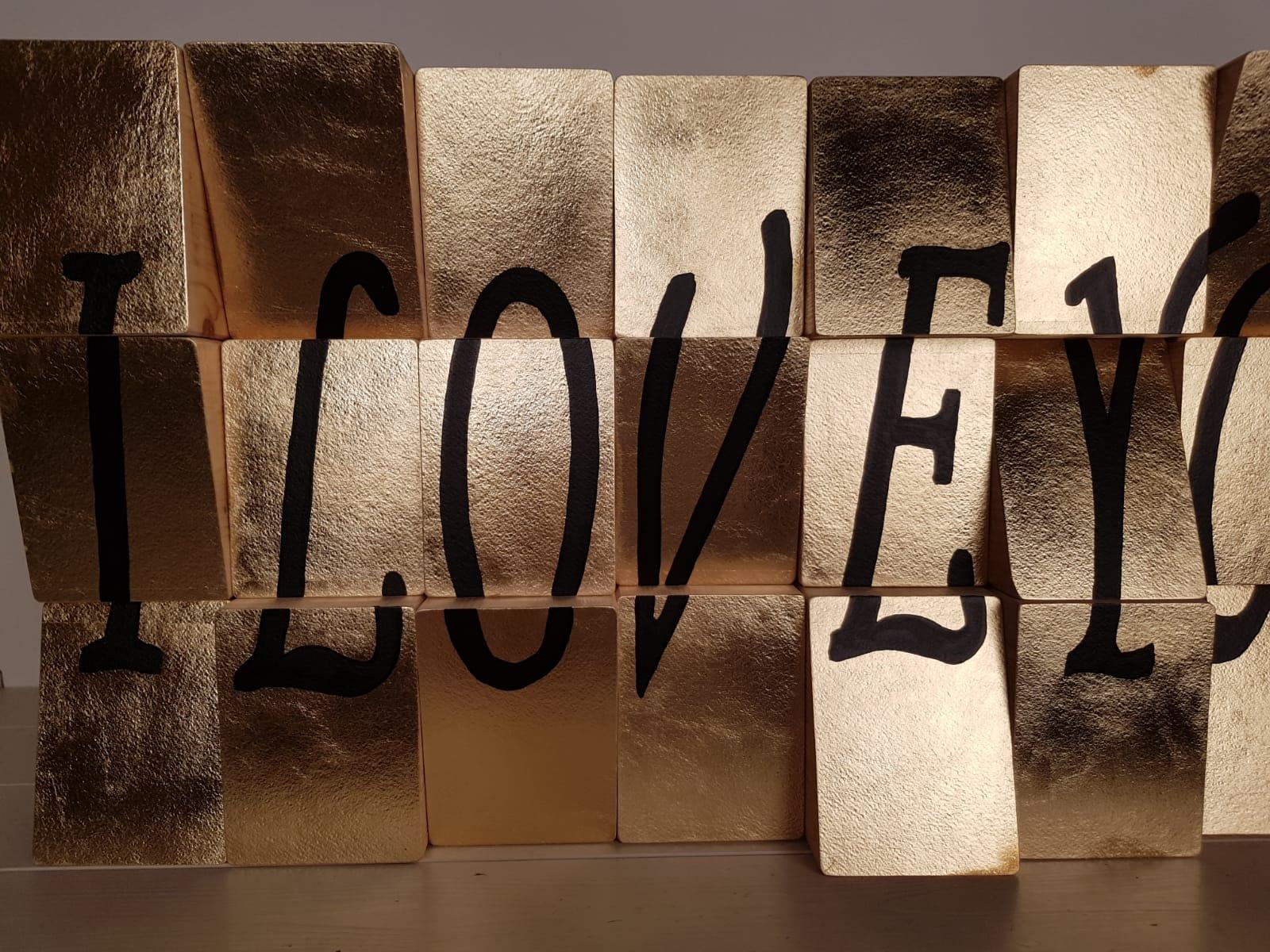 I Love You is an Original, Conceptual, Contemporary Art Piece.  Acrylic Paint on Canvas applied onto Wooden Blocks Personally Signed. 
Each block is then painted with acrylic paint on Acrylic Paint on Cotton Paper. If miscalculated at any point of
