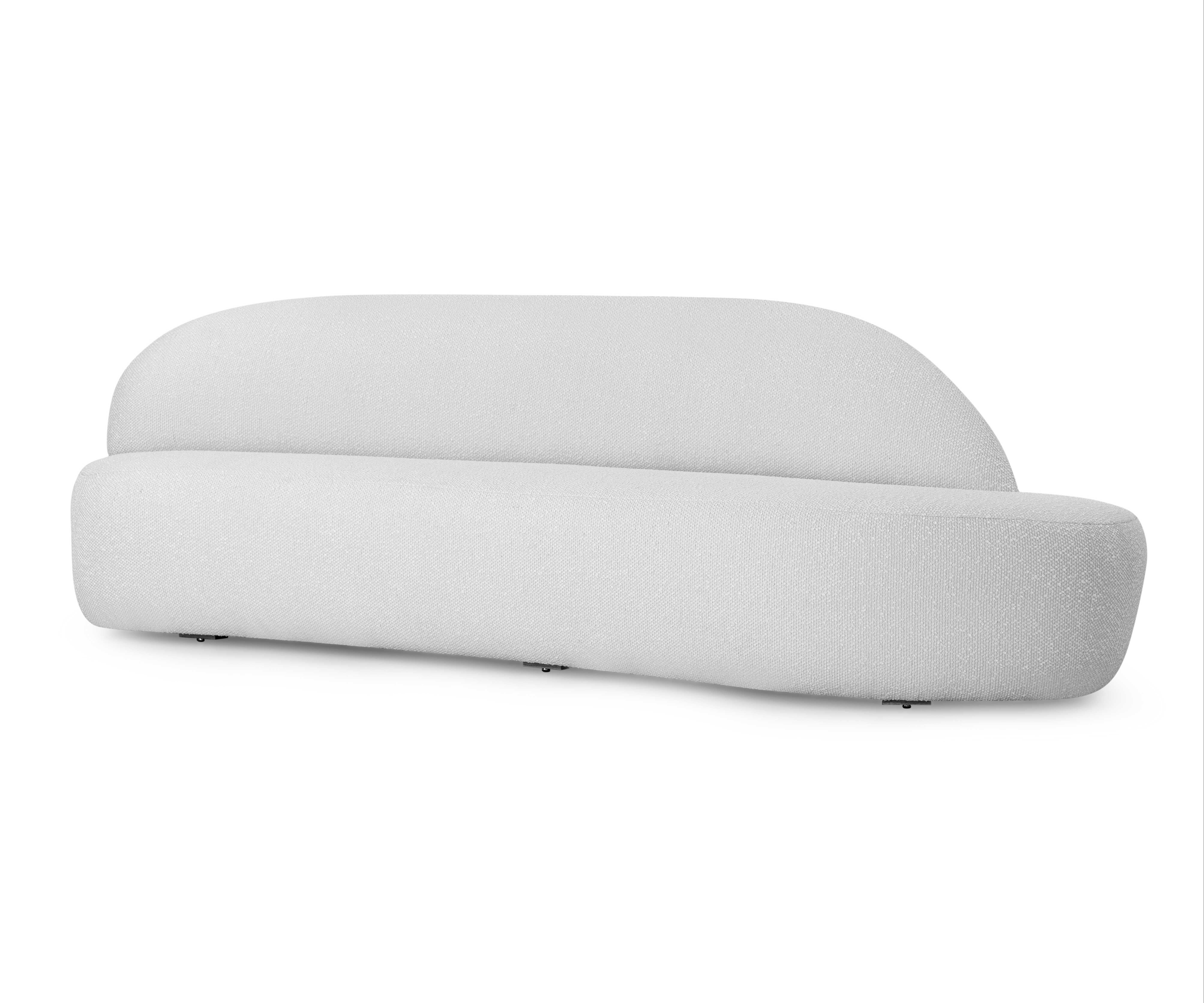 A customizable Ruy modular sofa designed by Sérgio Batista for Uultis in White Boucle fabric, left side module. The Ruy Modular Sofa, inspired by the iconic work of Ruy Ohtake, epitomizes the fusion of contemporary design and functional versatility.