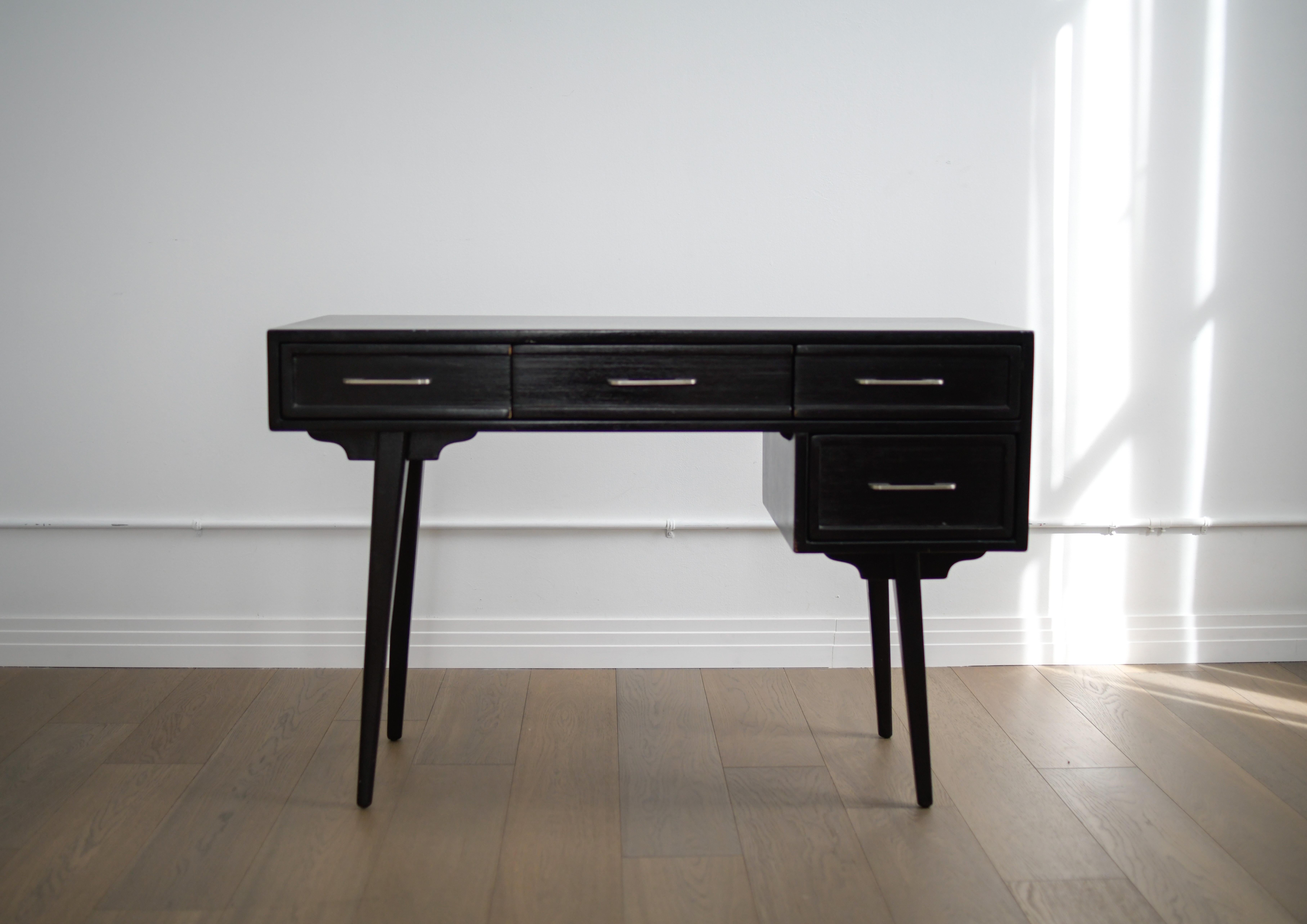 Extremely rare Rway black mid century desk with silver hardware. This desk in in decent vintage condition with some considerable scratching to the top. Looks like It was used as a writing desk. Despite that, it presents well and we also have a glass