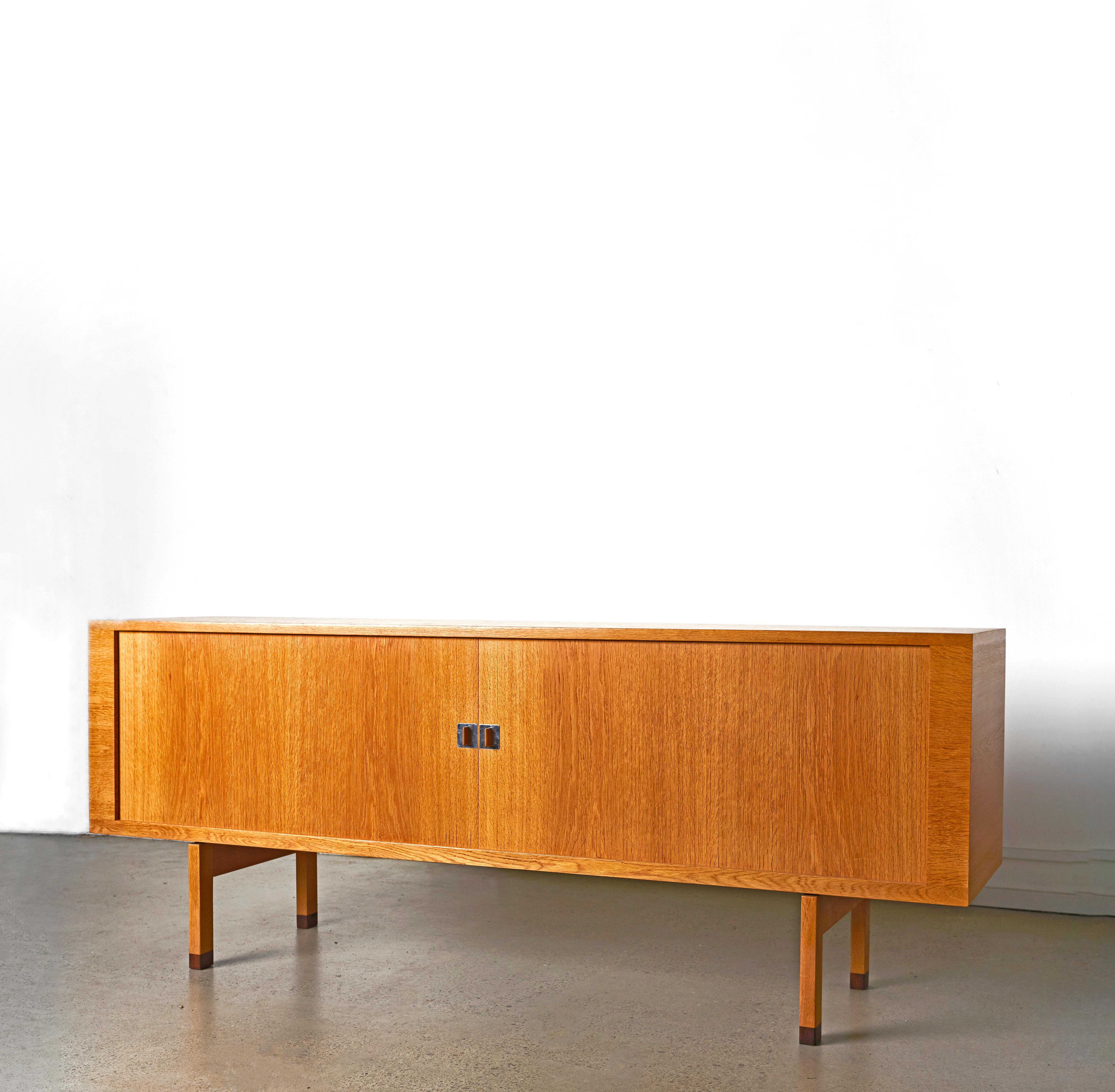 Rare and incredibly beautiful sideboard model RY-25 / President designed by Hans Wegner. Produced by Ry møbler in Denmark.

Dimensions:
Length: 200 cm. 
Height: 79 cm
Depth: 49 cm

Materials: Patinated Oak
Place of Origin: Denmark
Date of