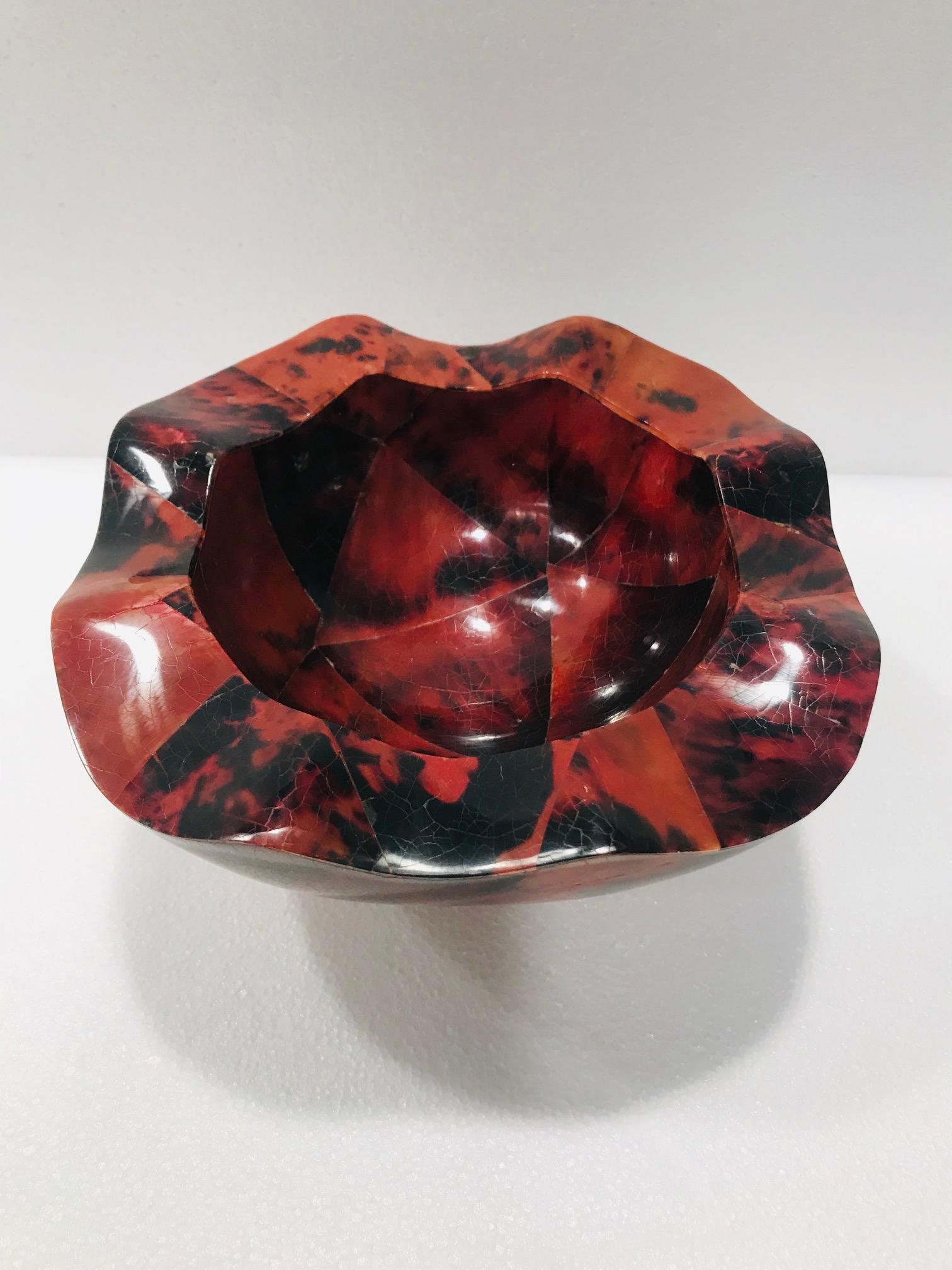 Handcrafted vintage R&Y Augousti decorative bowl with exotic pen-shell inlays over a palmwood frame. Lacquered finish with geometric patterns in red and black creates a mosaic design. Organic Modern bowl features a round tapered form with a sculpted