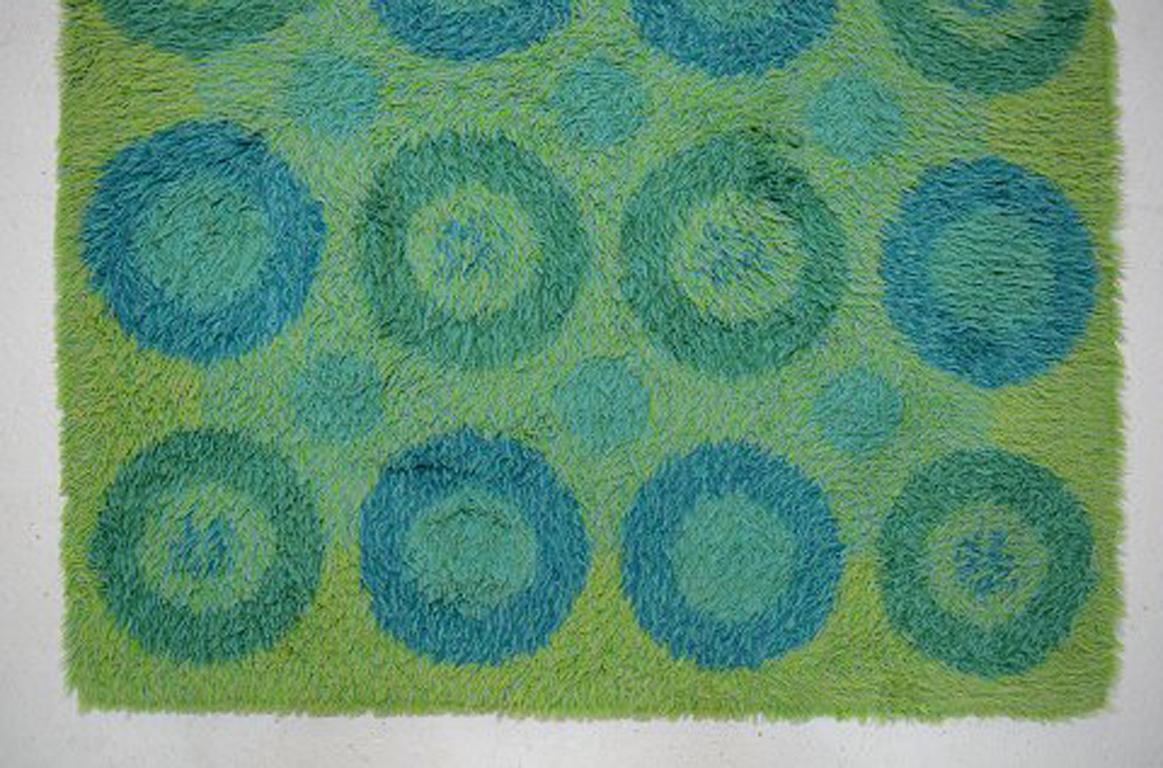 Rya carpet in green and blue design, 