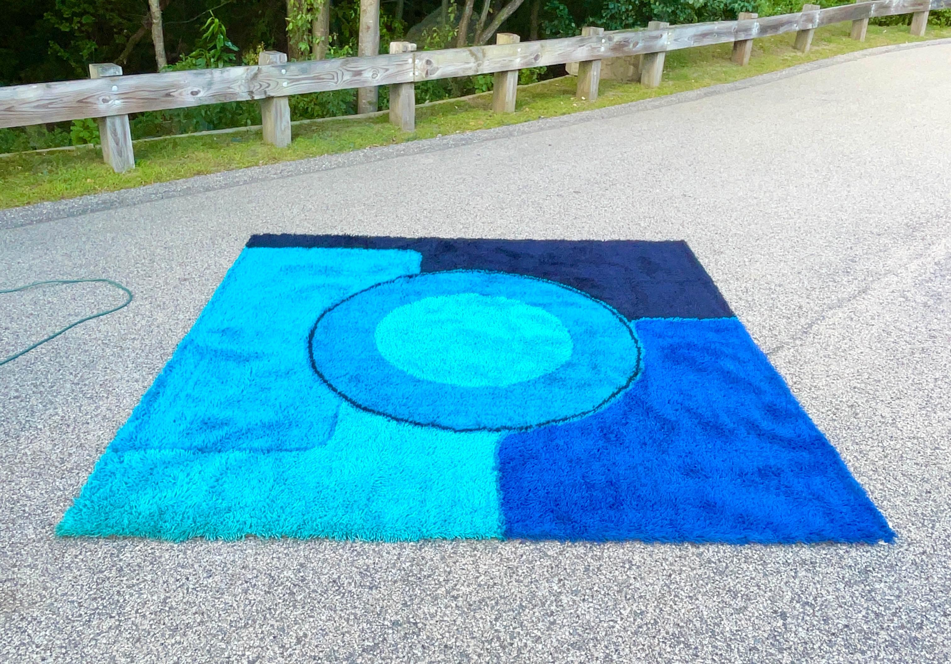 Deep dense 100% wool shag pile square rya rug produced in Denmark circa 1965 by Dania Taepper in an abstract collage of contrasting blues. 
Measures: 98