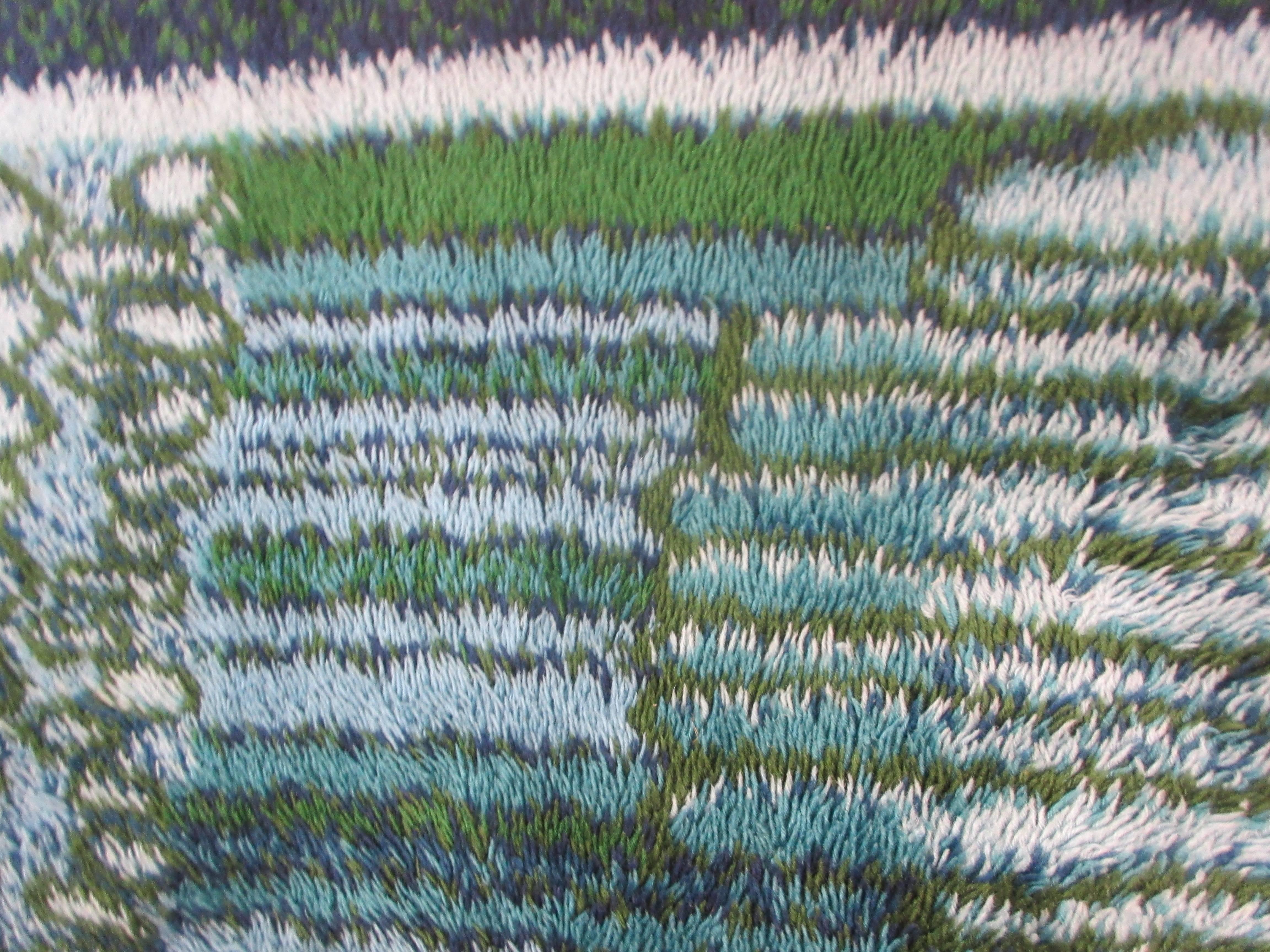 Rya rug by Ege in tones of blue and green with abstract design.  Perfect condition no wear or stains 