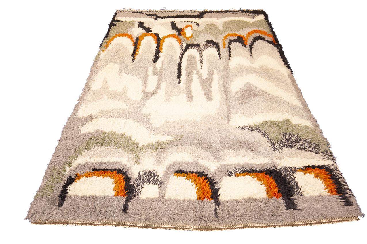 Indulge in the luxurious shagginess of this Swedish Rya rug, a perfect addition to any modern interior. The simplistic yet striking abstract design features a limited palette of soft white and gray colors, accented with lovely pops of color that add