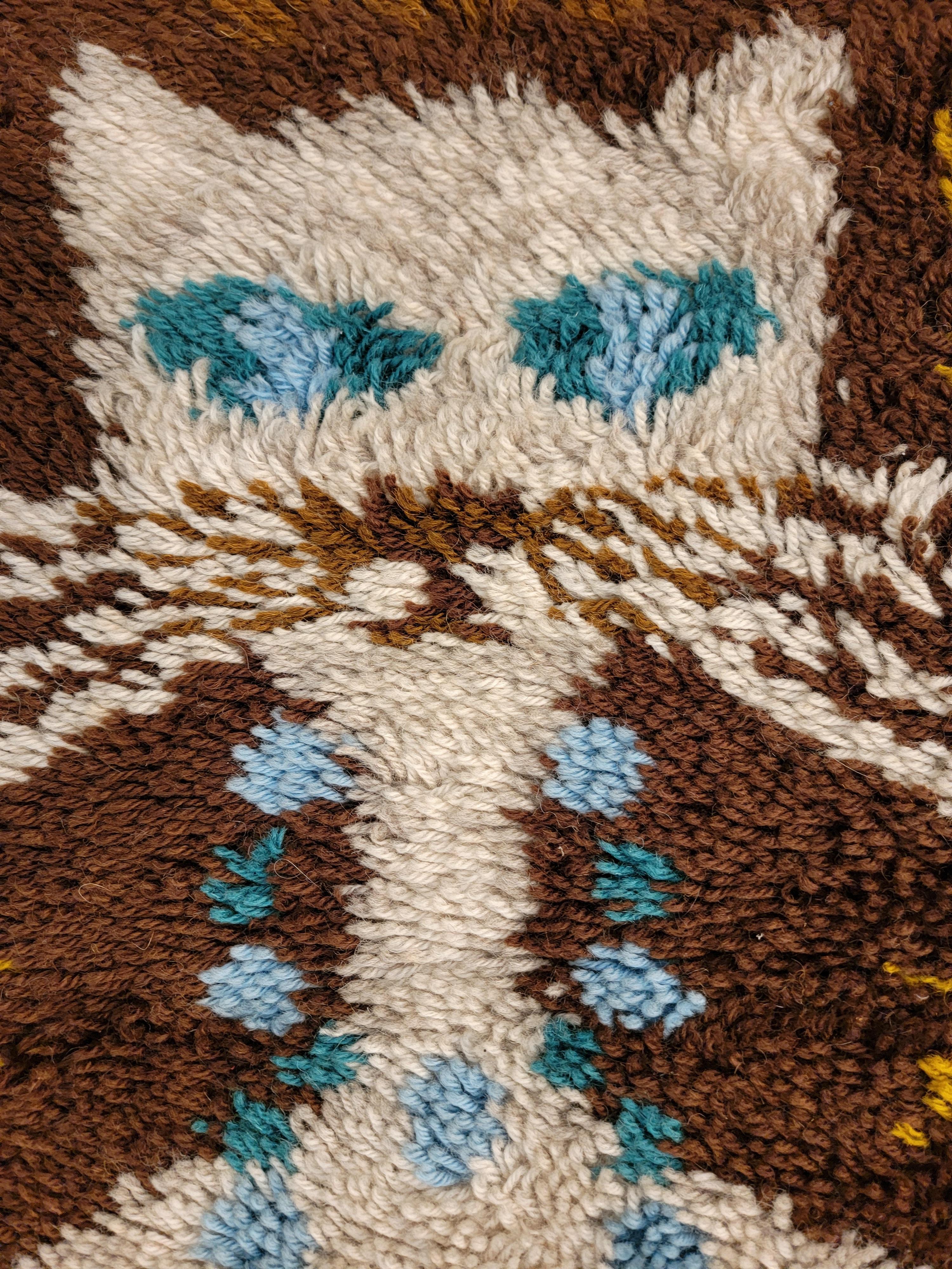 A rya or shag rug featuring a cat. Made in Denmark, circa. 1970's. 

Measures 27.5 inches wide. 26.5 inches high.