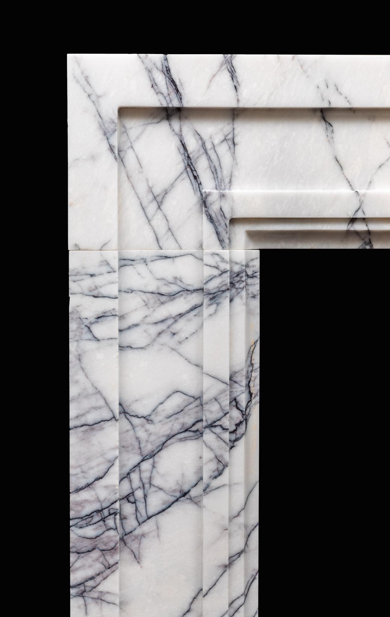 An early 20th century design which has a very modern appearance when produced in this strongly veined lilac marble. The shape encapsulates simple architectural form and it's this simplicity that really shows off the richness in such a luxury marble.