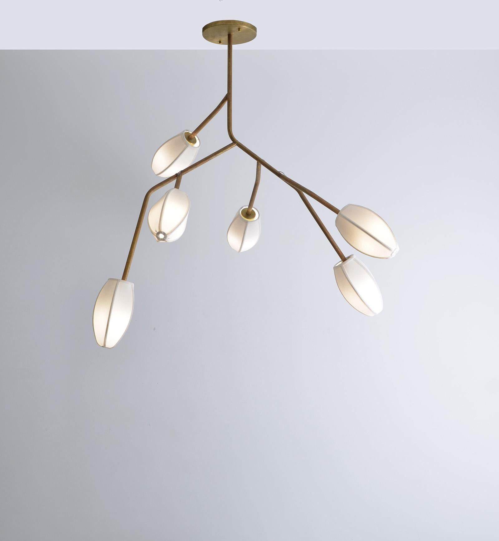 Customized product. 

Sacurá - Sculptural light pendant in brass with natural finish without varnish. The finish on this sculptural pendant light darkens over time. The mall cotton domes in various colors.

The design of this pendant light is based