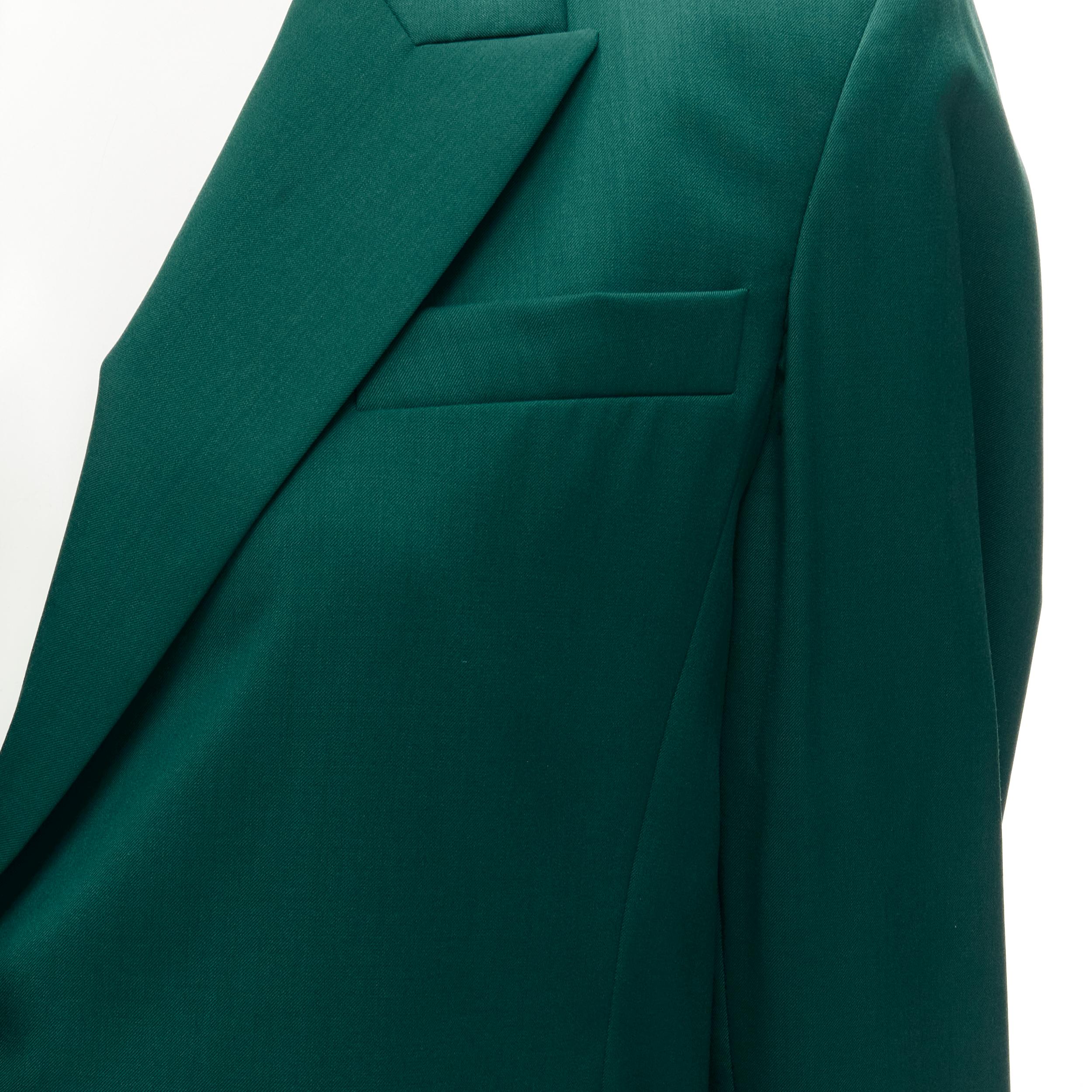 RYAN ROCHE 100% wool green peal lapel single button blazer jacket US2 XS 
Reference: JACG/A00042 
Brand: Ryan Roche 
Material: Wool 
Color: Green 
Pattern: Solid 
Closure: Button 
Extra Detail: Padded shoulders. Peak lapel. Single buttons. Slit