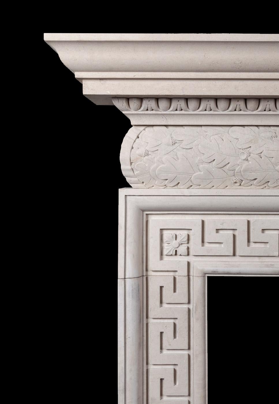 A mid-18th century style fireplace, which features a barrel shaped frieze carved with oak leafs and acorns. Resting on the frieze is an egg and dart cornice and surrounding the aperture a continuous Greek key pattern.

Can be distressed to