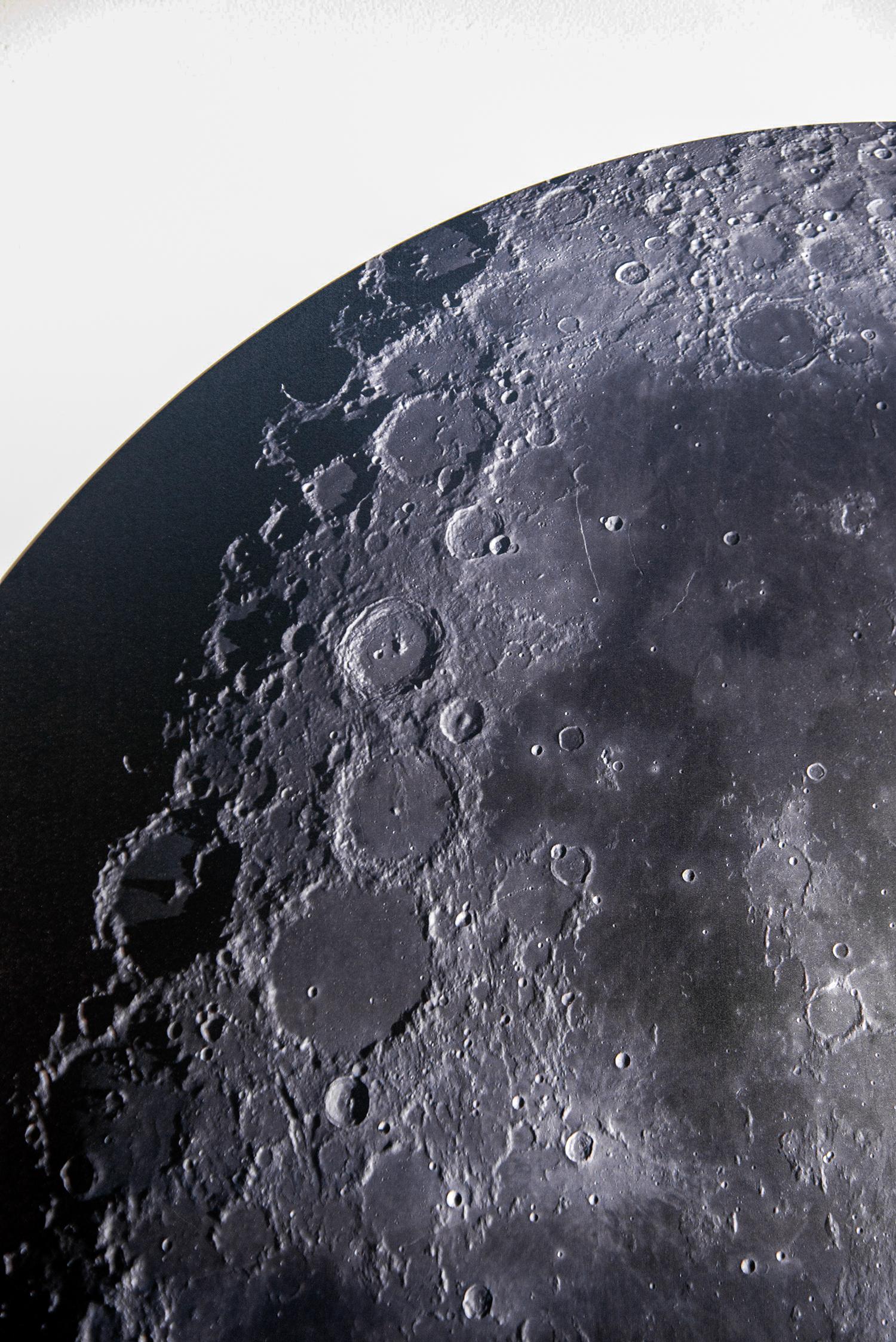 As a child, Ryan Van Der Hout owned a telescope and was fascinated by the sight of the moon in the night sky. This iconic image of the moon as viewed from earth is re-imagined when Van Der Hout folds the full colour photographic print he created.