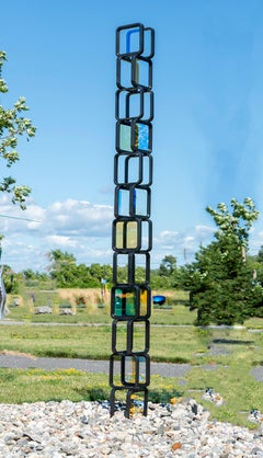 La tour Chroma n° 2, sculpture géométrique abstraite géométrique en acier et verre