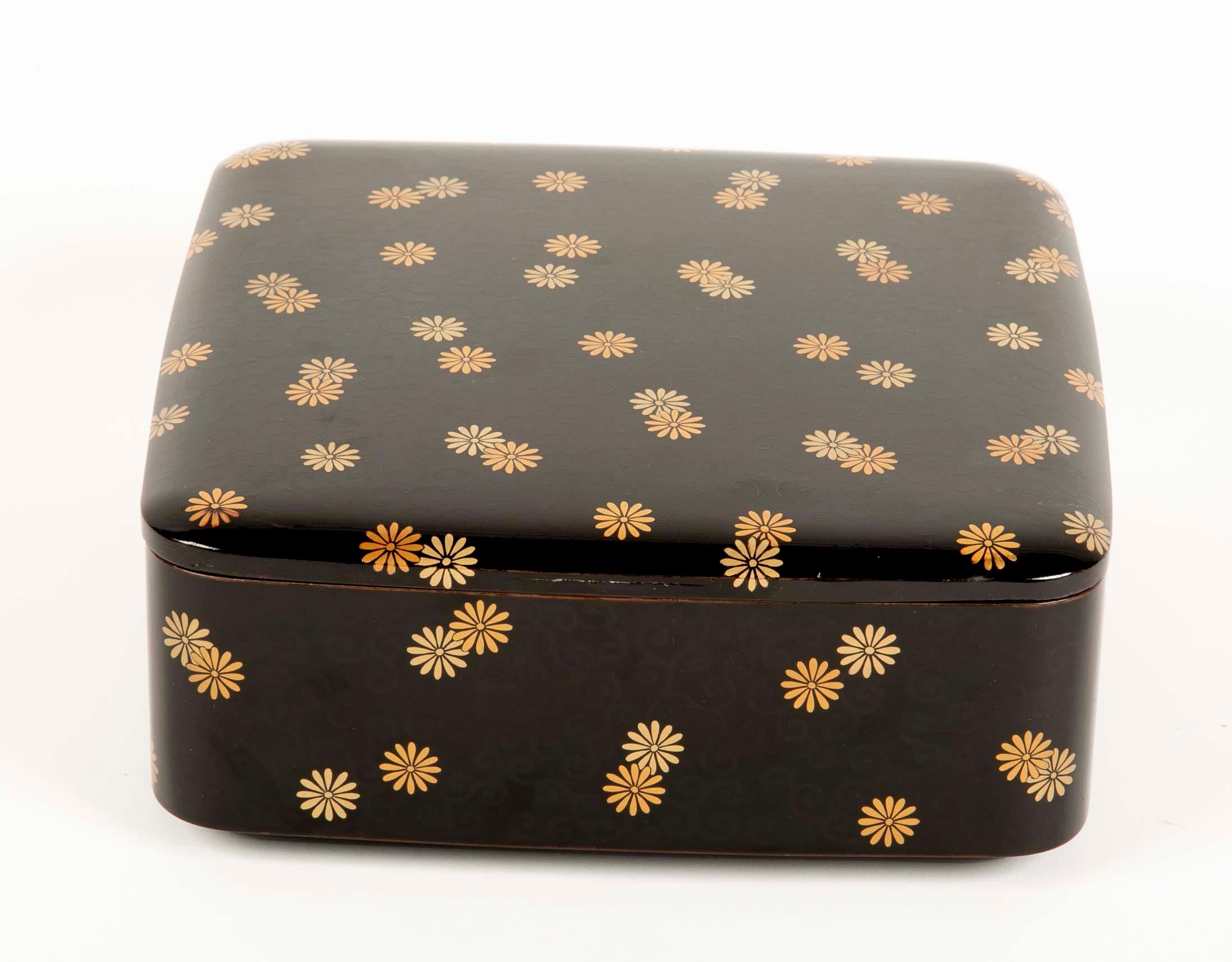 Japanese Ryoshibako ( document ) box of black lacquer with overall scattered gold chrysanthemum and engraved vine tendrils. Mid Meiji Period - 1890's.