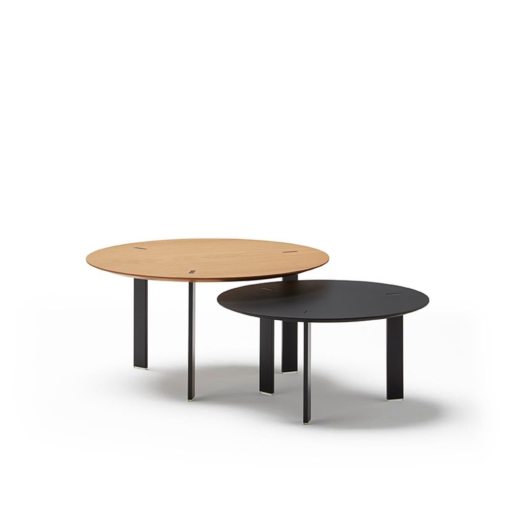 Occasional coffee table designed in a minimalist distinctive style. Designed by Victor Carrasco for Viccarbe. 

The steel legs are mortised through the top, creating a singular look. Thanks to the multiple finish options, the table can be used in
