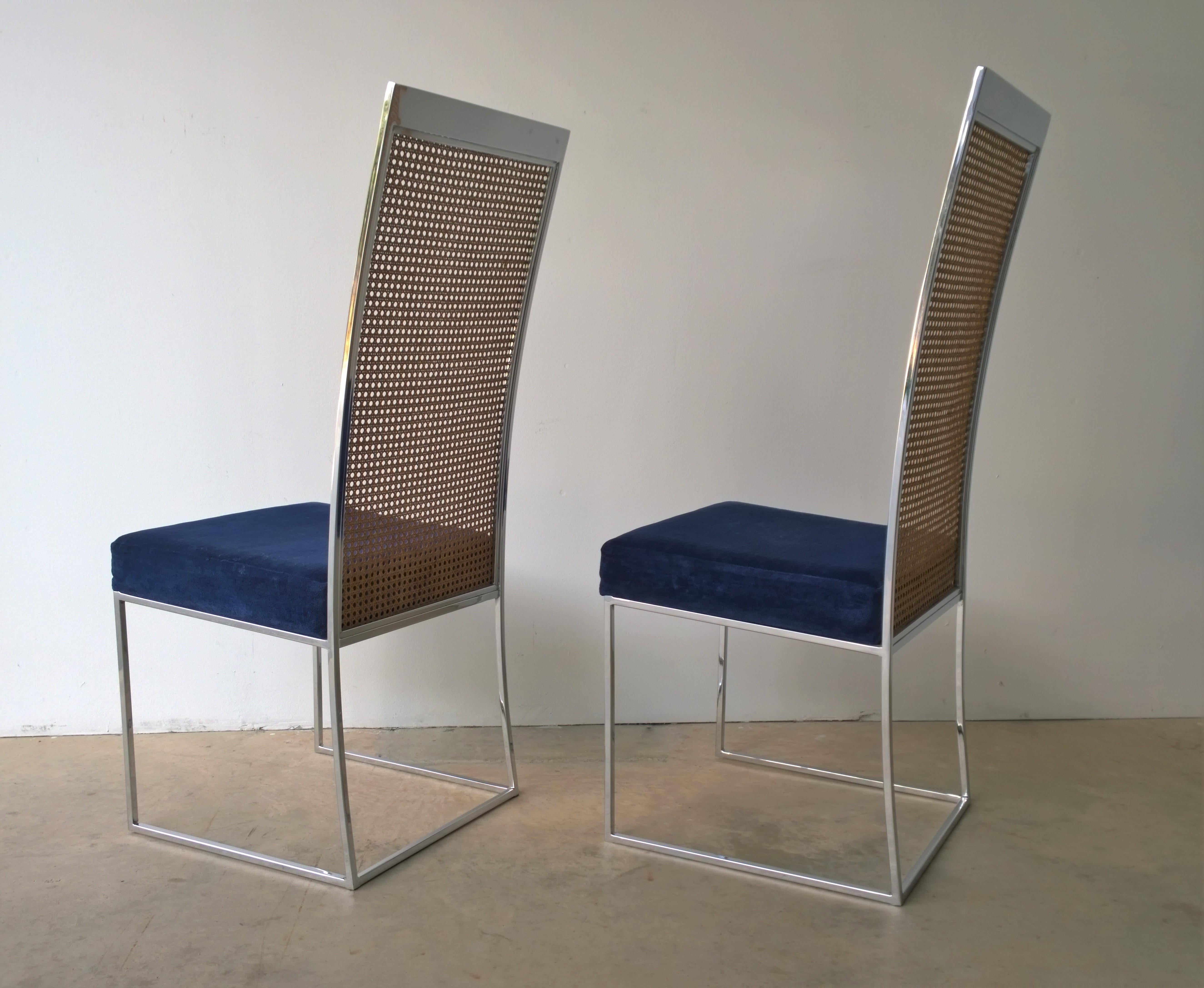 Offered is a set of 2 Mid-Century Modern original upholstery in navy blue chenille or cotton velvet Milo Baughman for Thayer Coggin chrome frame and cane back side (armless) dining chairs. The wood cane is in very good condition which is quite