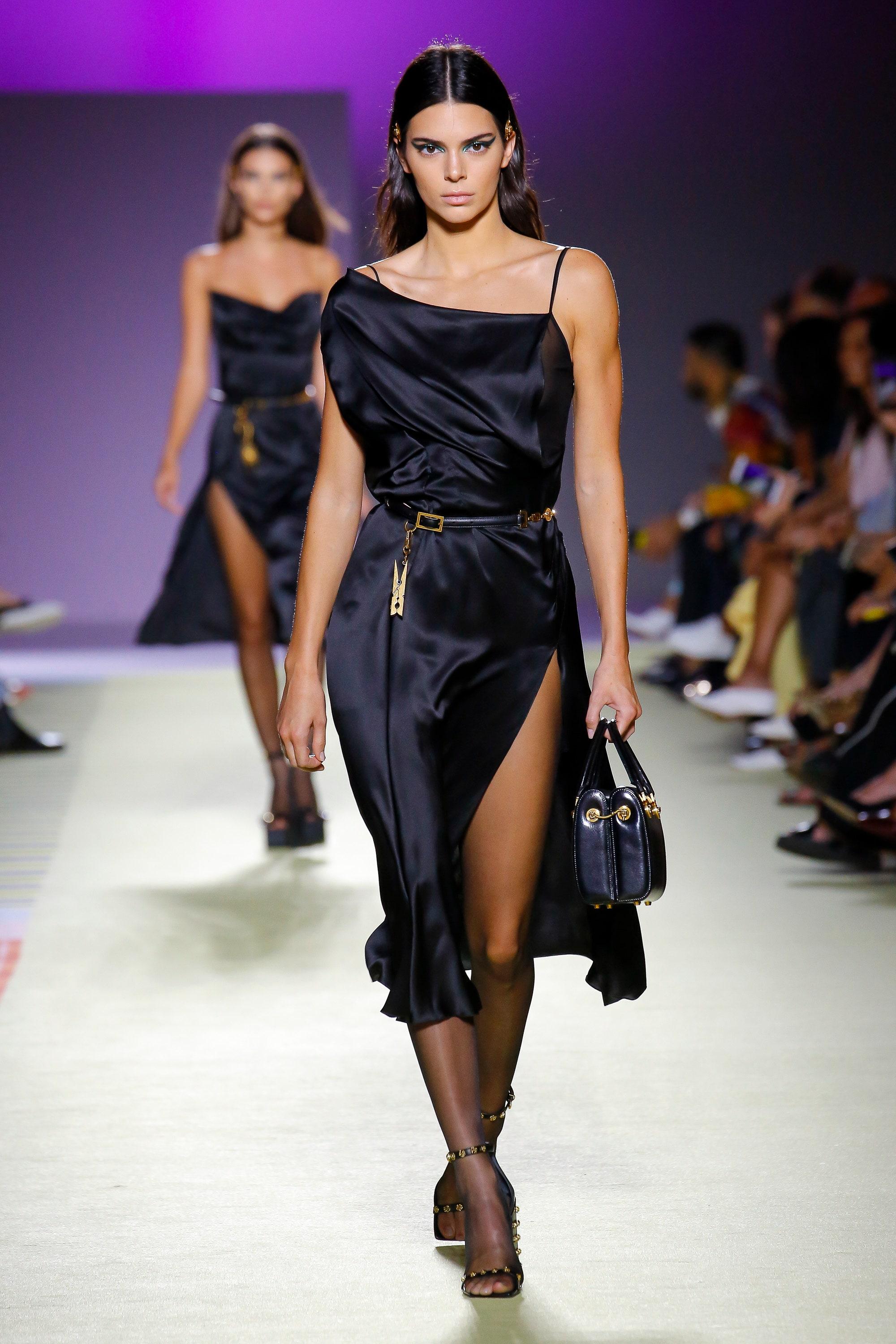  VERSACE

Versace’s lustrous black silk-satin slip dress was a standout style in the house’s glamorous SS19 runway show.
 It’s crafted in Italy with asymmetric shoulder straps and drapes fluidly across the bodice, before gathering via stitched side