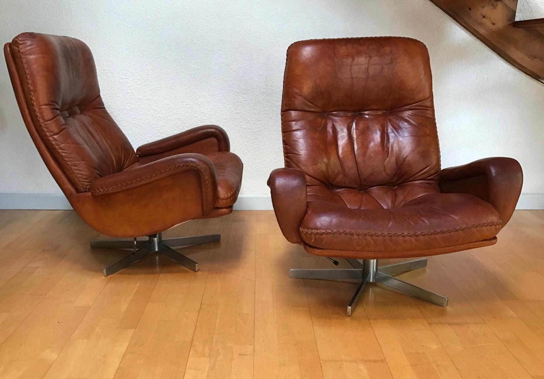 Vintage pair of swivel armchair and one ottoman S 231. by De Sede craftsman from Switzerland
This same chair was used as a prop in the 1969 James Bond film On Her Majesty's Secret Service.
Polished chrome swivel base, the lounge armchair and