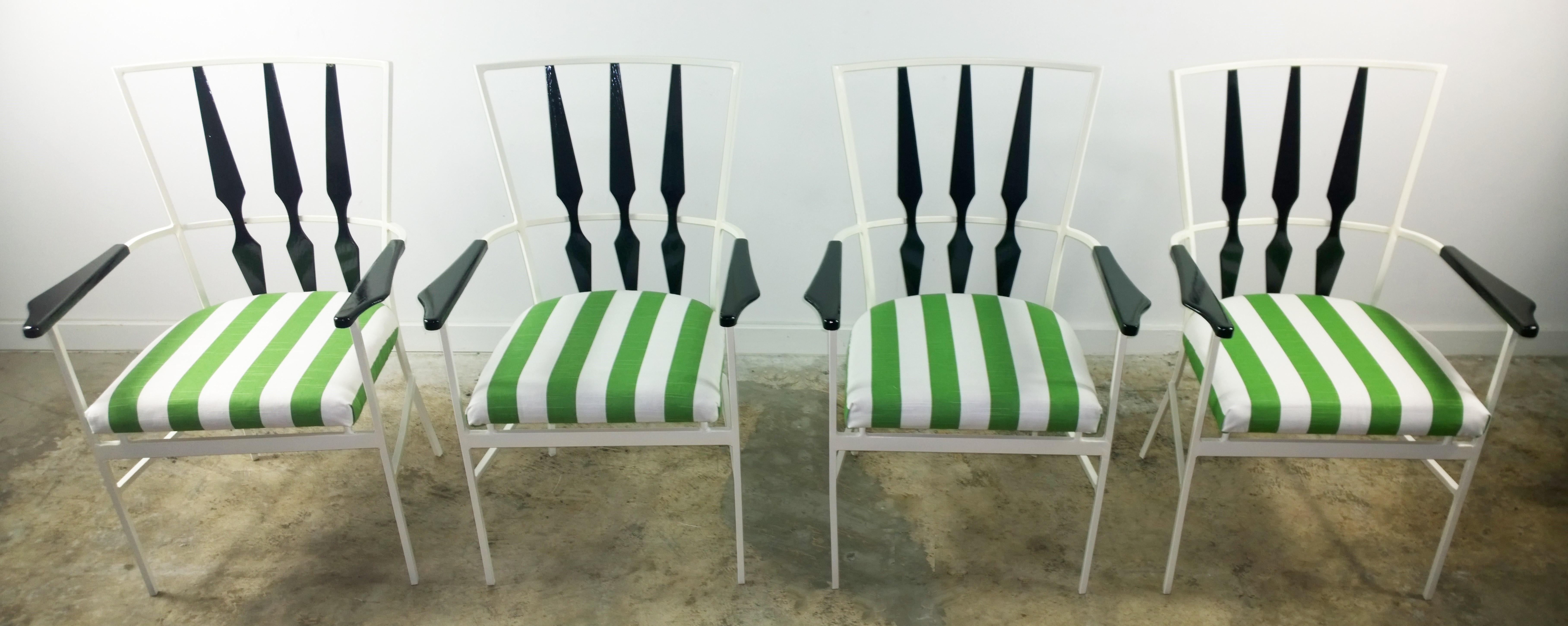 Offered is a set of four Mid-Century Modern signed John Salterini newly enameled white steel and newly lacquered black wood with newly upholstered removable seat cushions in a green and white stripe indoor or outdoor fabric over foam over wood.