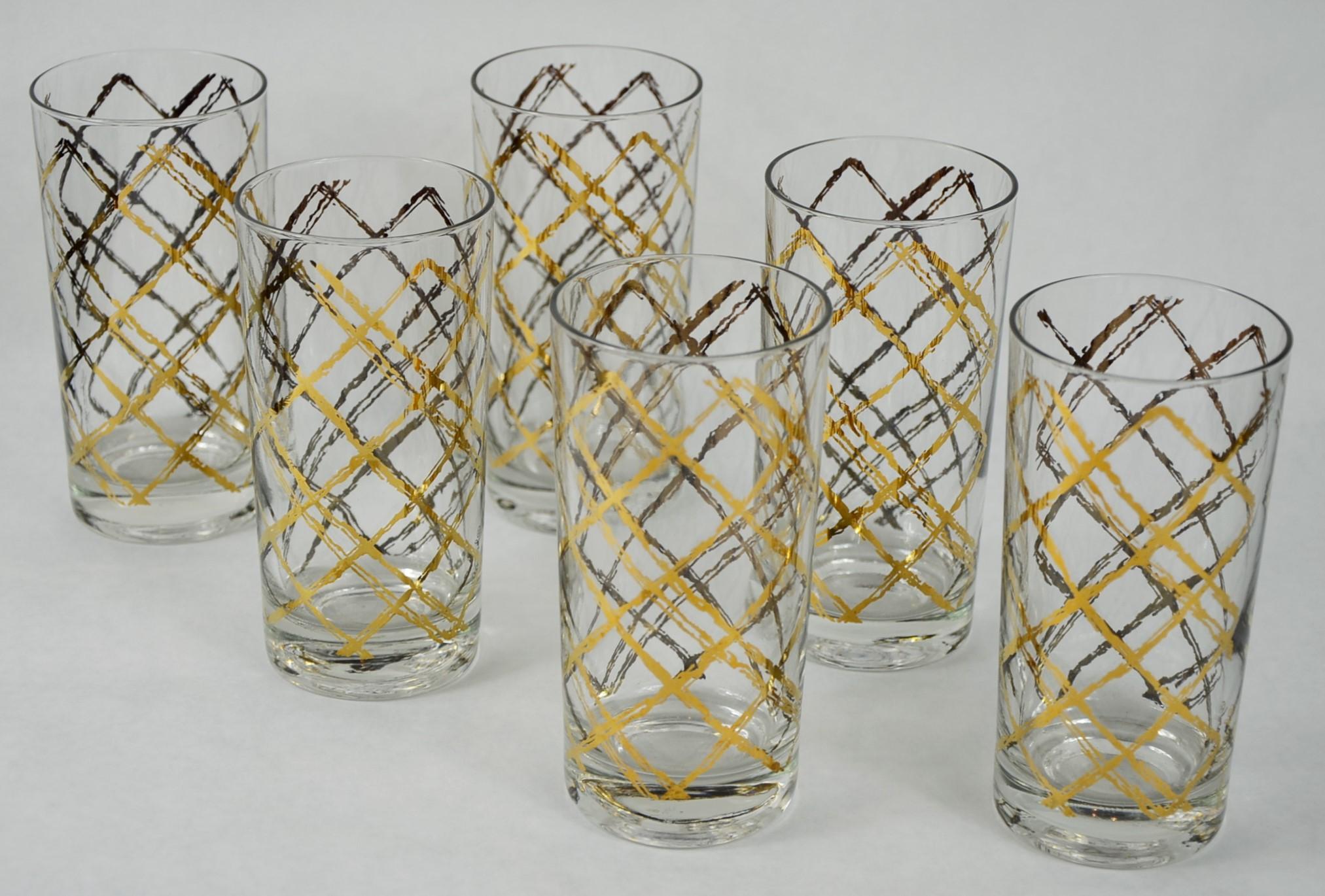 Offered is a set of six Mid-Century Modern Georges Briard clear glass with cross hatch gold and copper gilt overlay pattern tall Tom Collins cocktail glasses. Fabulous cocktail glasses for entertaining or as the perfect gift. The gilt gold and