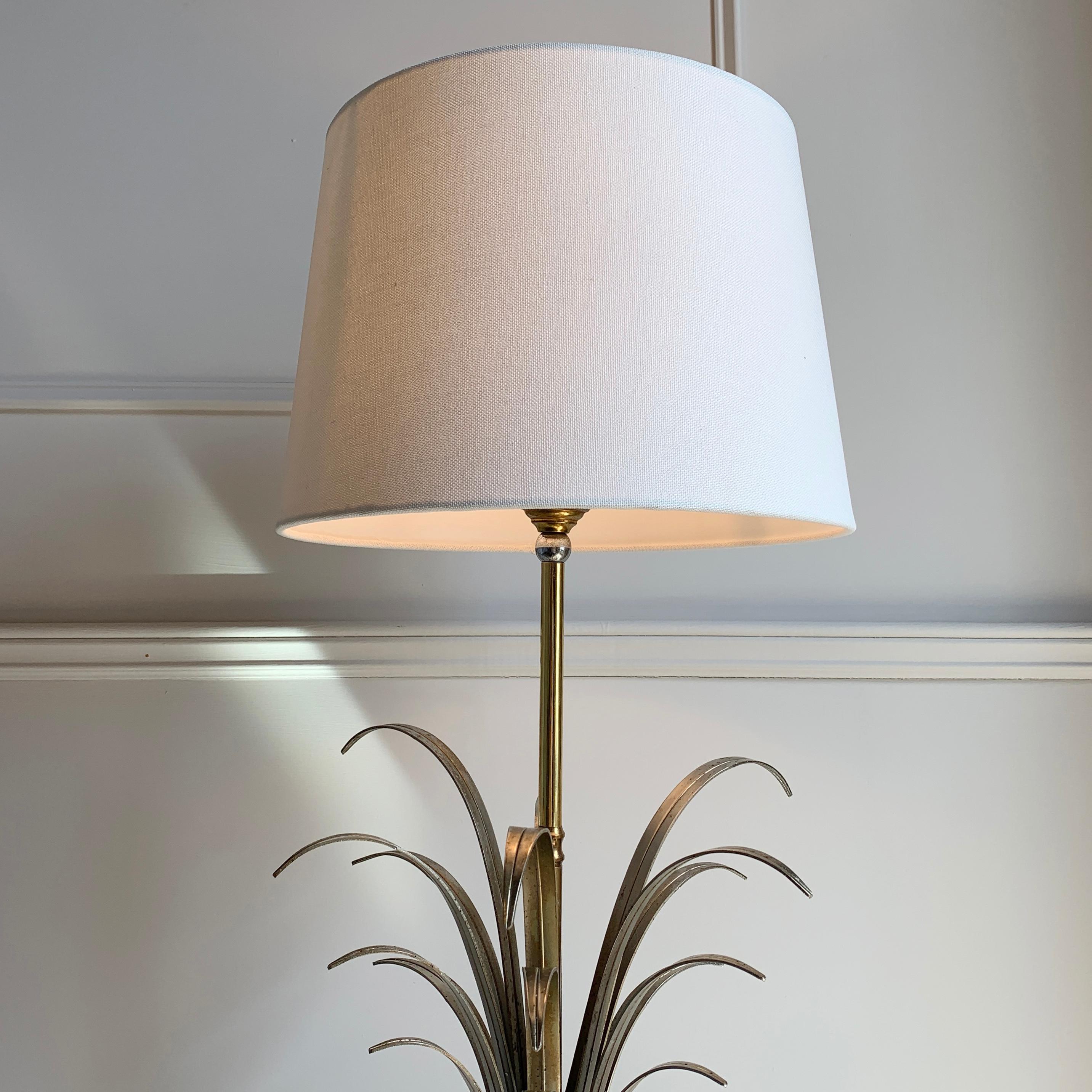 An elegant and tall console/table lamp dating to the mid 1970s by SA Boulanger of Belgium, the long silver coloured metal leaf fronds set inside a chalice are a trademark design of Boulanger, this model is set upon a marble base, with a single lamp