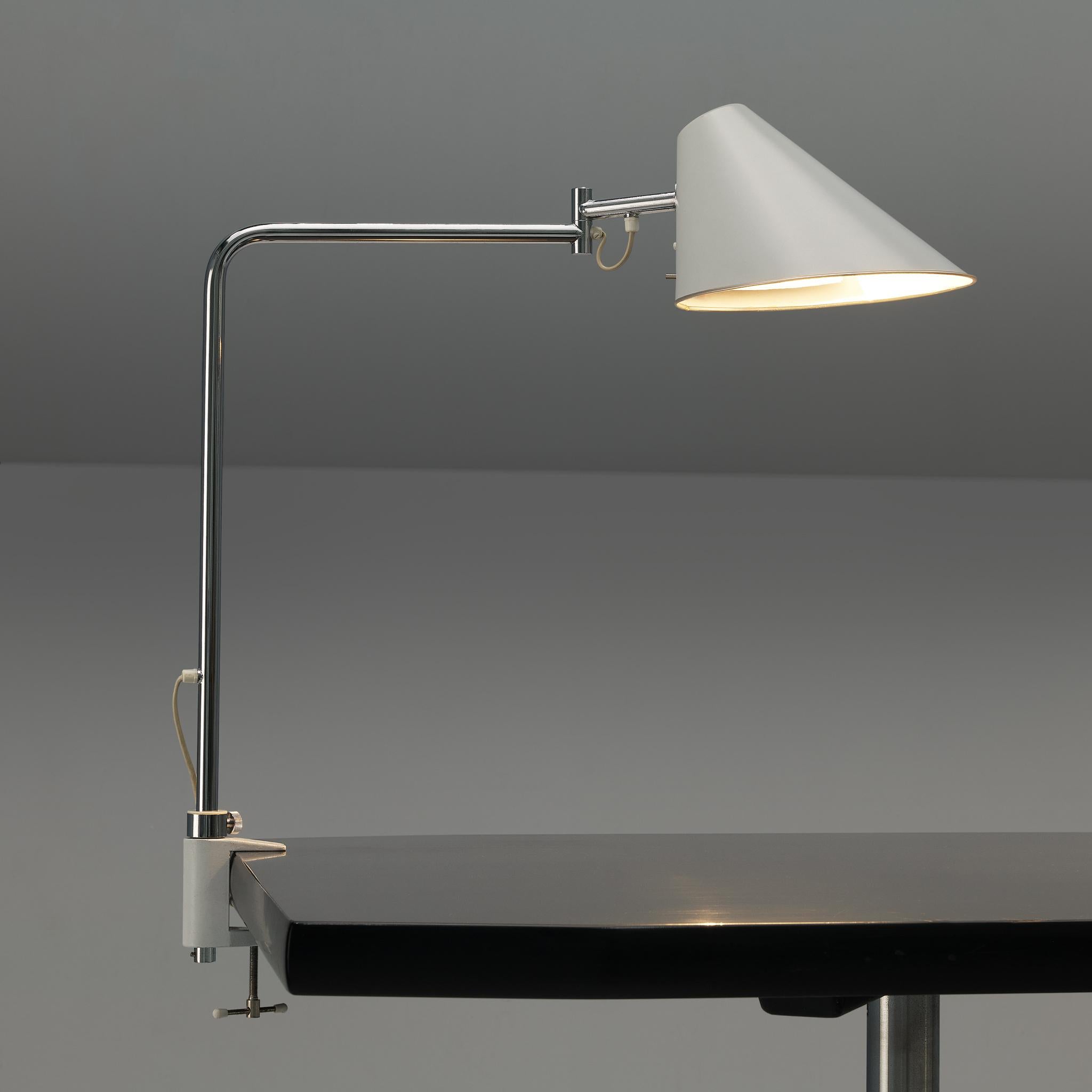 S. Björklund and L. Gustafsson for Falkenbergs Belysning Sweden, 'Delux' desk lamp with clamp, chromed steel, aluminum, Sweden, 1970s

This modern Swedish table desk lamp features an oval shaped lamp shade, accompanied with an adjustable reflector