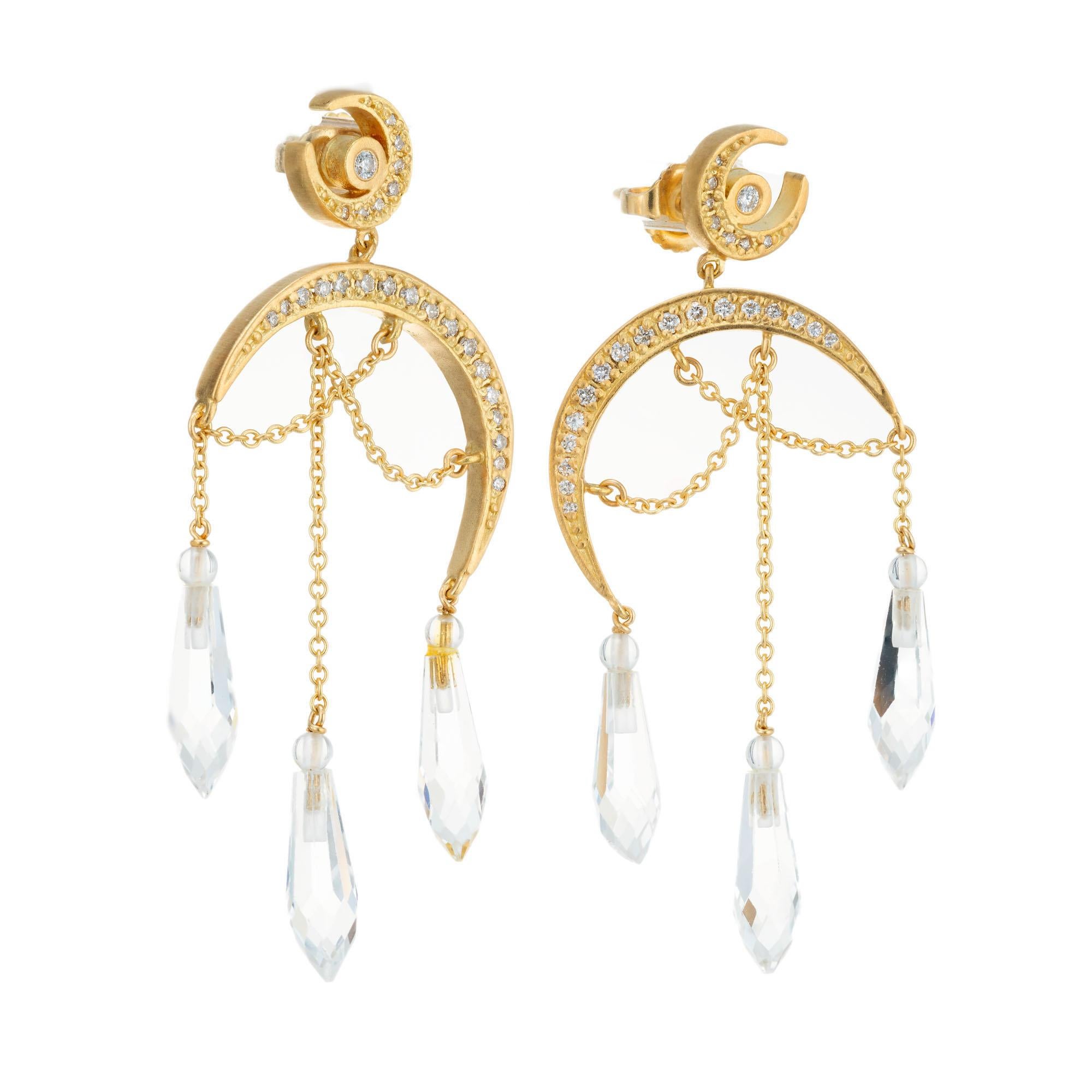 Topaz and diamond earrings. 50 round brilliant cut diamonds set in two 18k yellow gold crescent moon shaped chandelier settings with 6 briolette Topaz dangles.  

50 round brilliant cut diamonds, G SI approx. .50cts
6 briolette white/clear topaz,