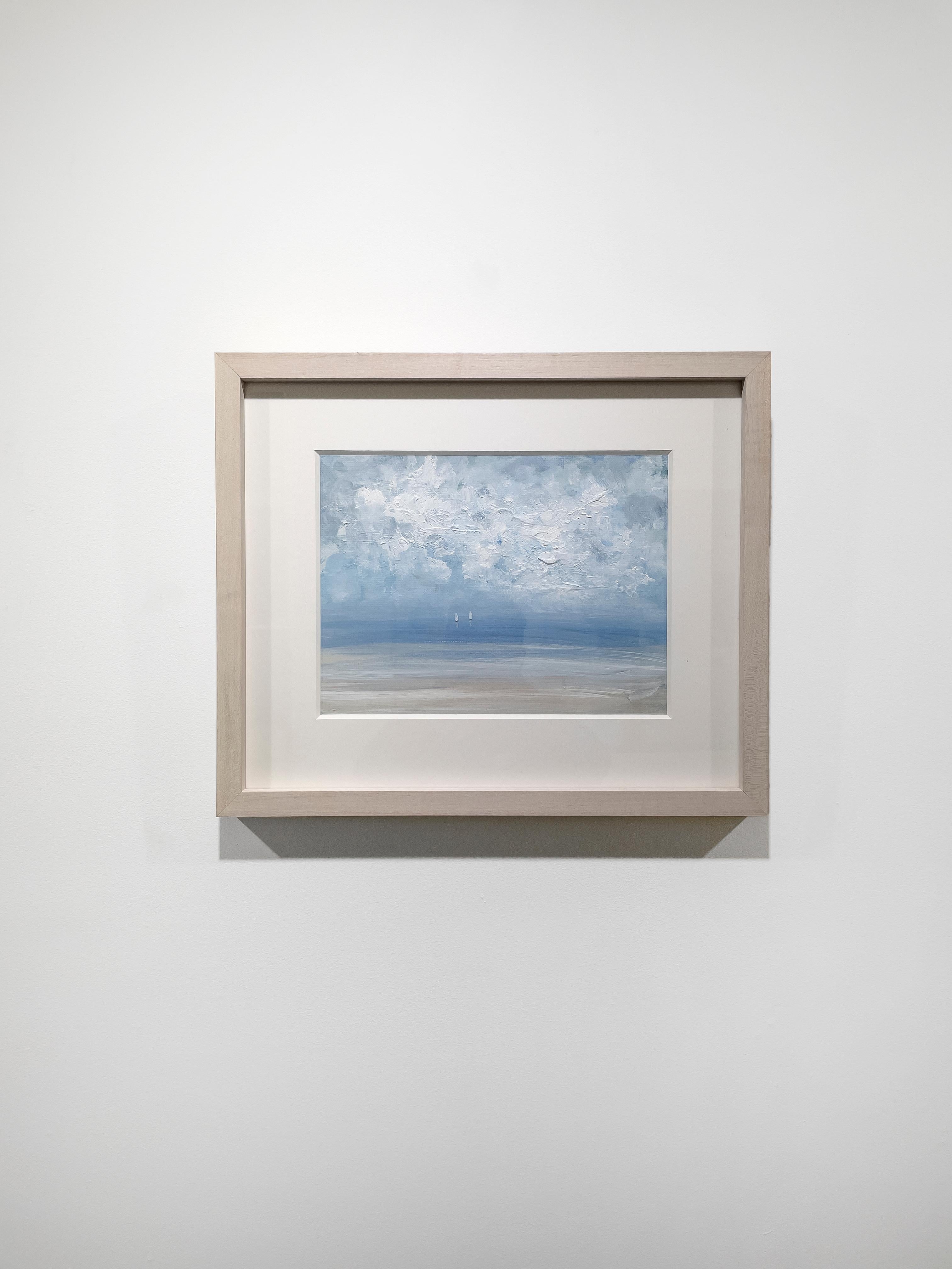 This contemporary seascape painting by S.C. Aldo is made with acrylic paint on Arches paper. It depicts a lightly abstracted coastal scene with a light blue sky, textured abstract clouds and two small white sailboats sailing near the horizon,