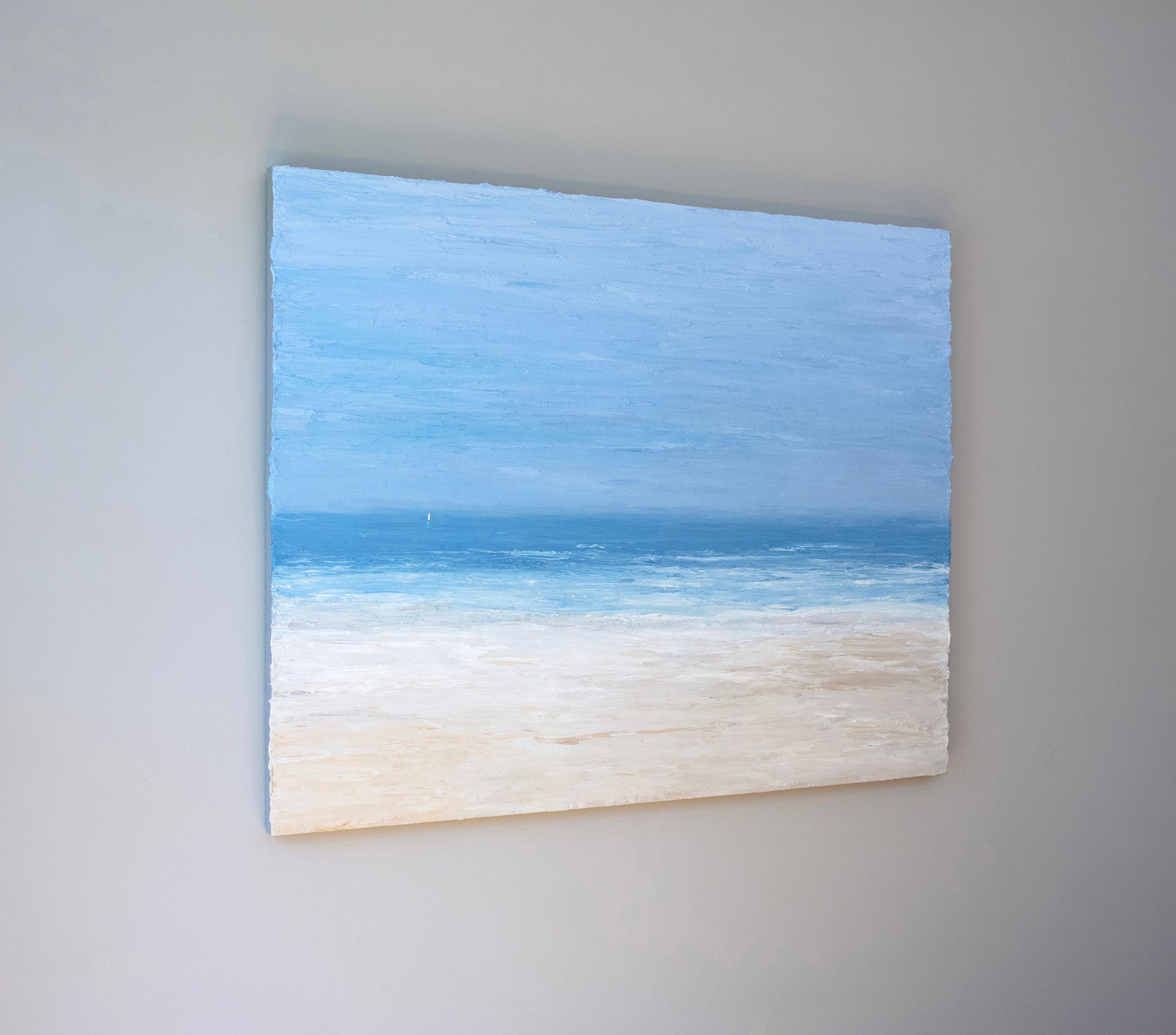 This large abstracted seascape painting by S. Cora Aldo features a cool, light blue palette with warm sand tones in the foreground of the composition. The painting captures an abstracted view of the water from a sandy beach, with a textured finish.