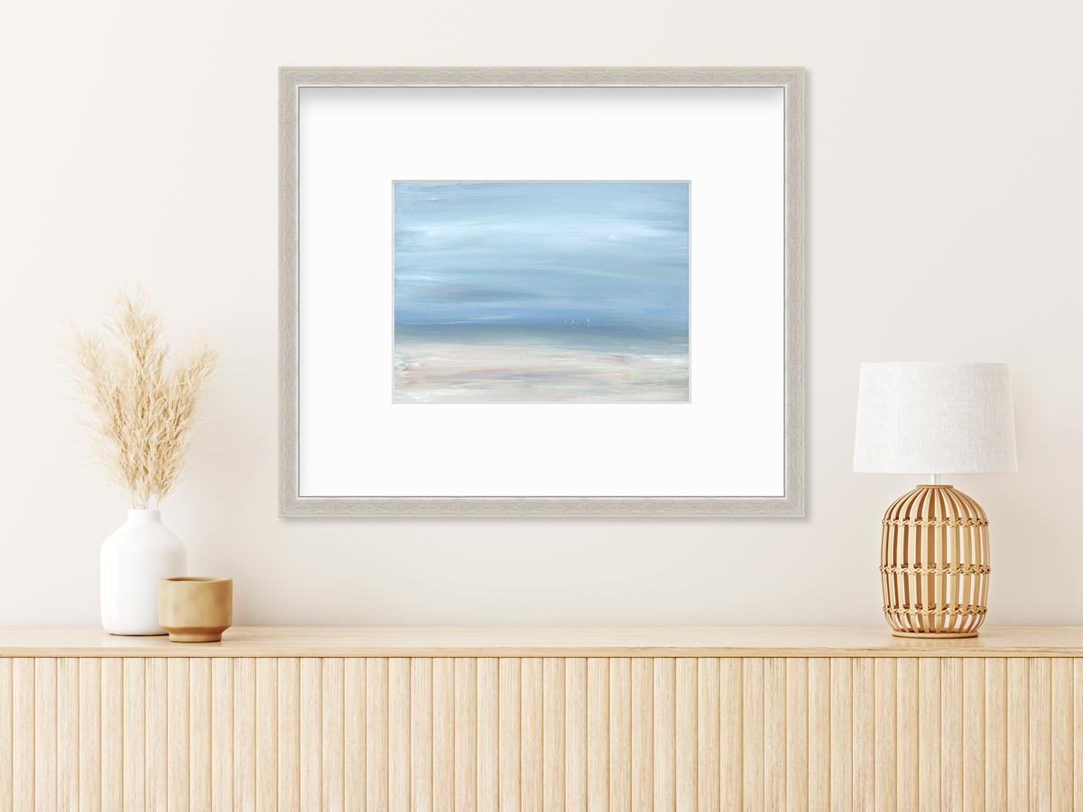This contemporary seascape limited edition print by S.C. Aldo features a coastal scene with a light blue sky and three small sailboats just visible along the horizon. 

This limited edition print is an edition size of 195. Printed with pigment ink