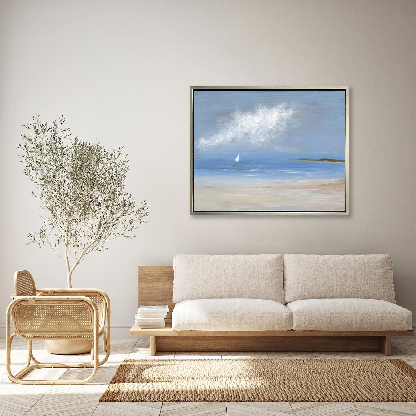 This limited edition seascape print by S.C. Aldo captures an abstracted coastal scene overlooking water from a sandy shore, with greenery lining part of the horizon and a sailboat sailing in the distance under abstract white clouds. 

This Limited