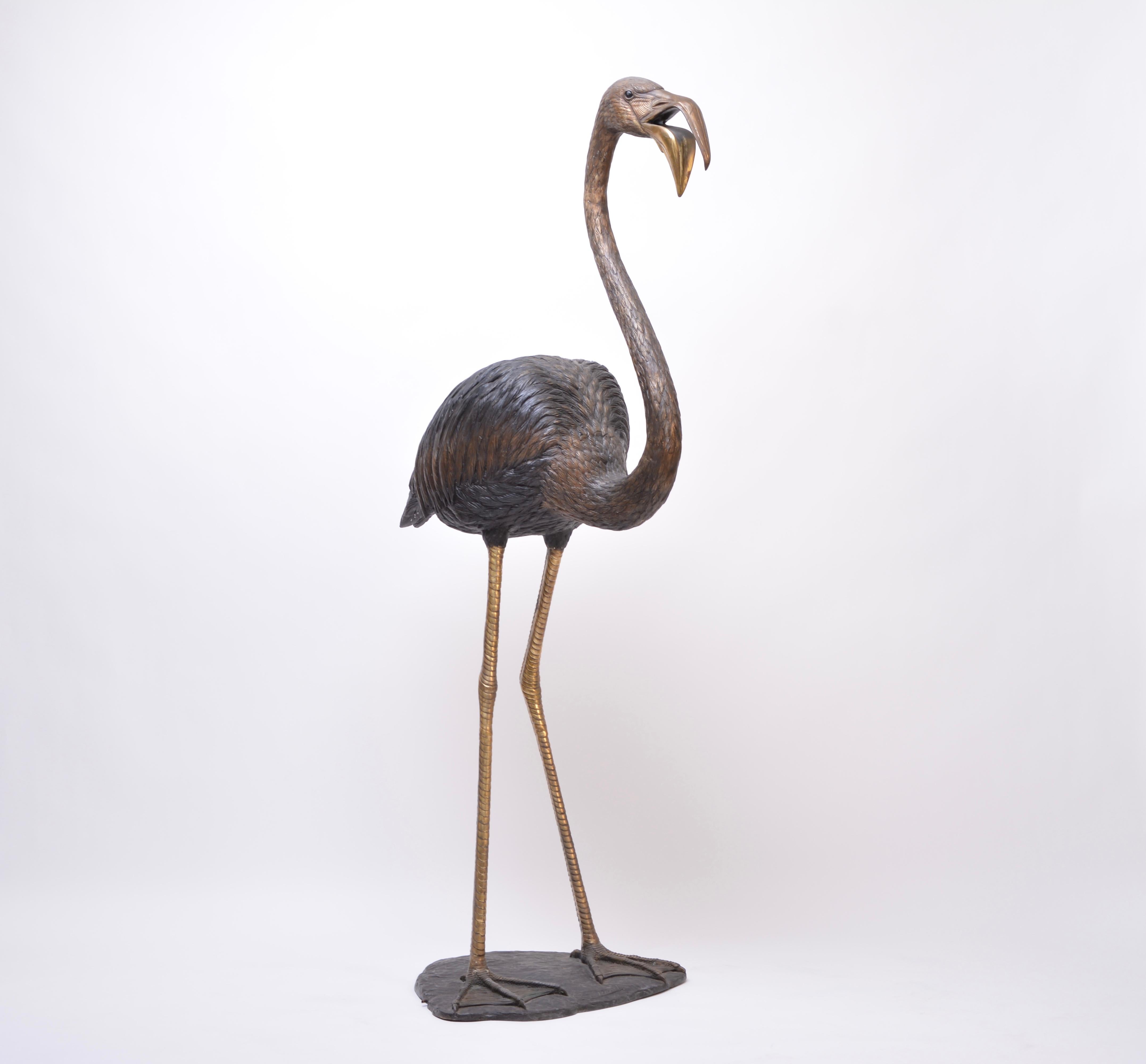 This huge flamingo figure is made of bronze. It is signed on the base S. David. The figure can be used as a water spout.