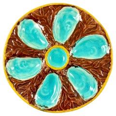 S. Fielding & Co. Piatto maiolica inglese marrone/turchese con alghe marine