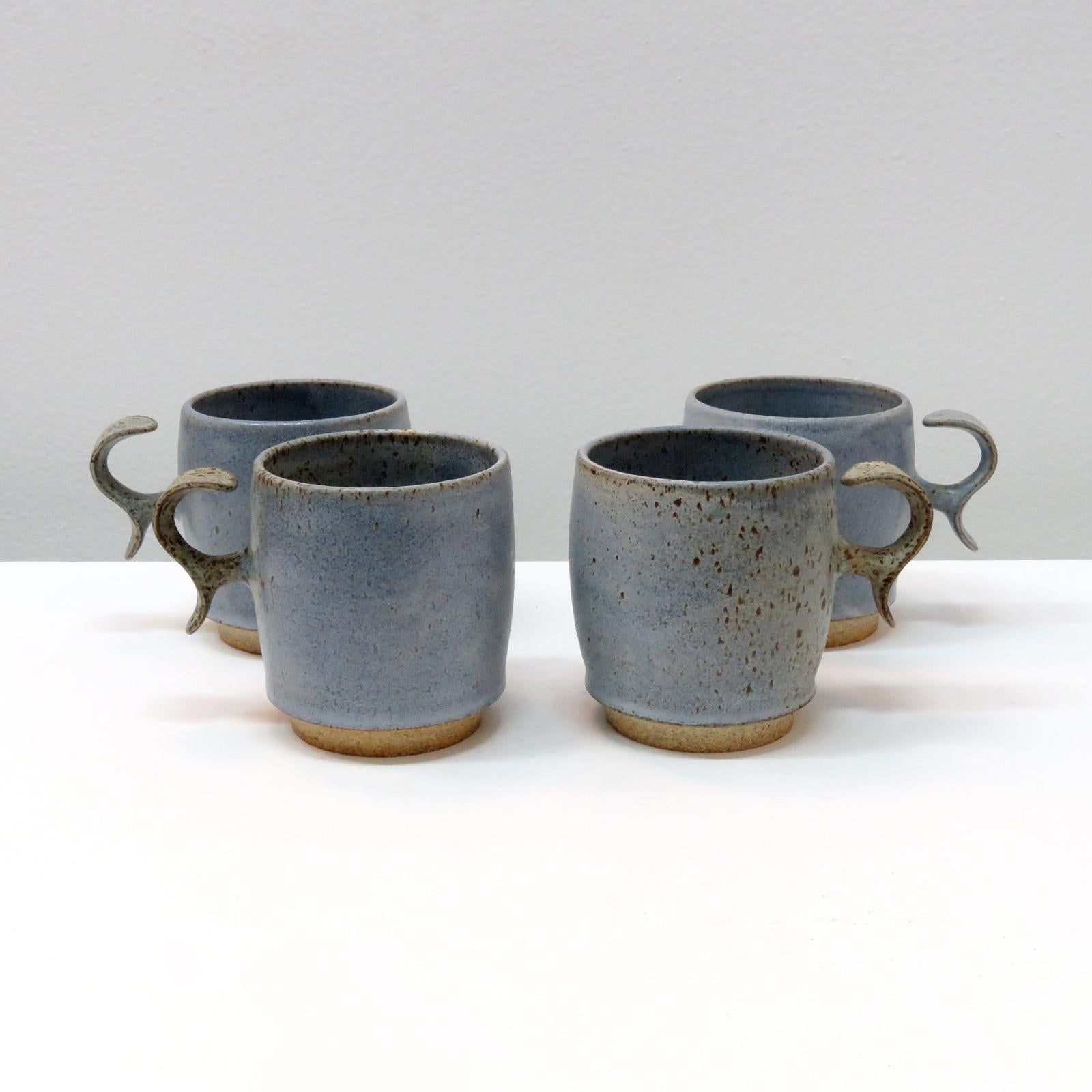 wonderful 'S-Handle' mugs, handcrafted by Los Angeles based ceramicist Jed Farlow for Farlow Design. High fired stoneware with matte 'blue jeans' glaze. Designed with a human-centered approach in mind, these one-of-a-kind mugs are experimenting with