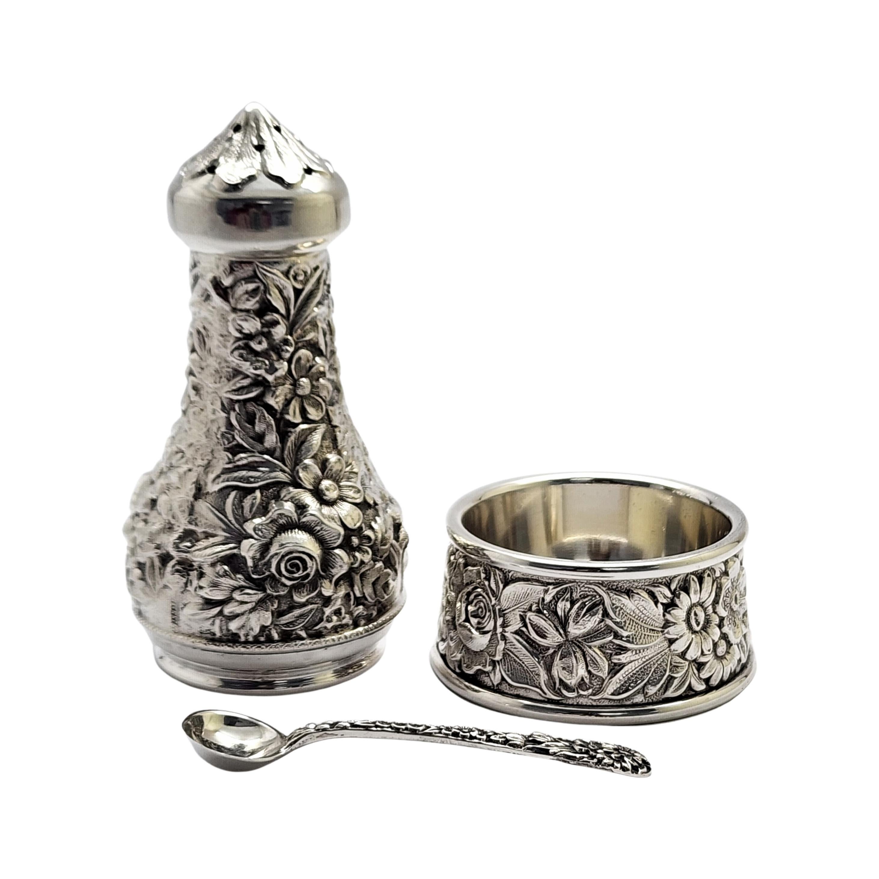Sterling silver 3 piece set salt cellar, spoon and pepper shaker by S. Kirk and Son, pattern #59A.

All 3 pieces feature a beautiful repousse design with highly detailed flowers and leaves.

The shaker measures approx 3 1/4
