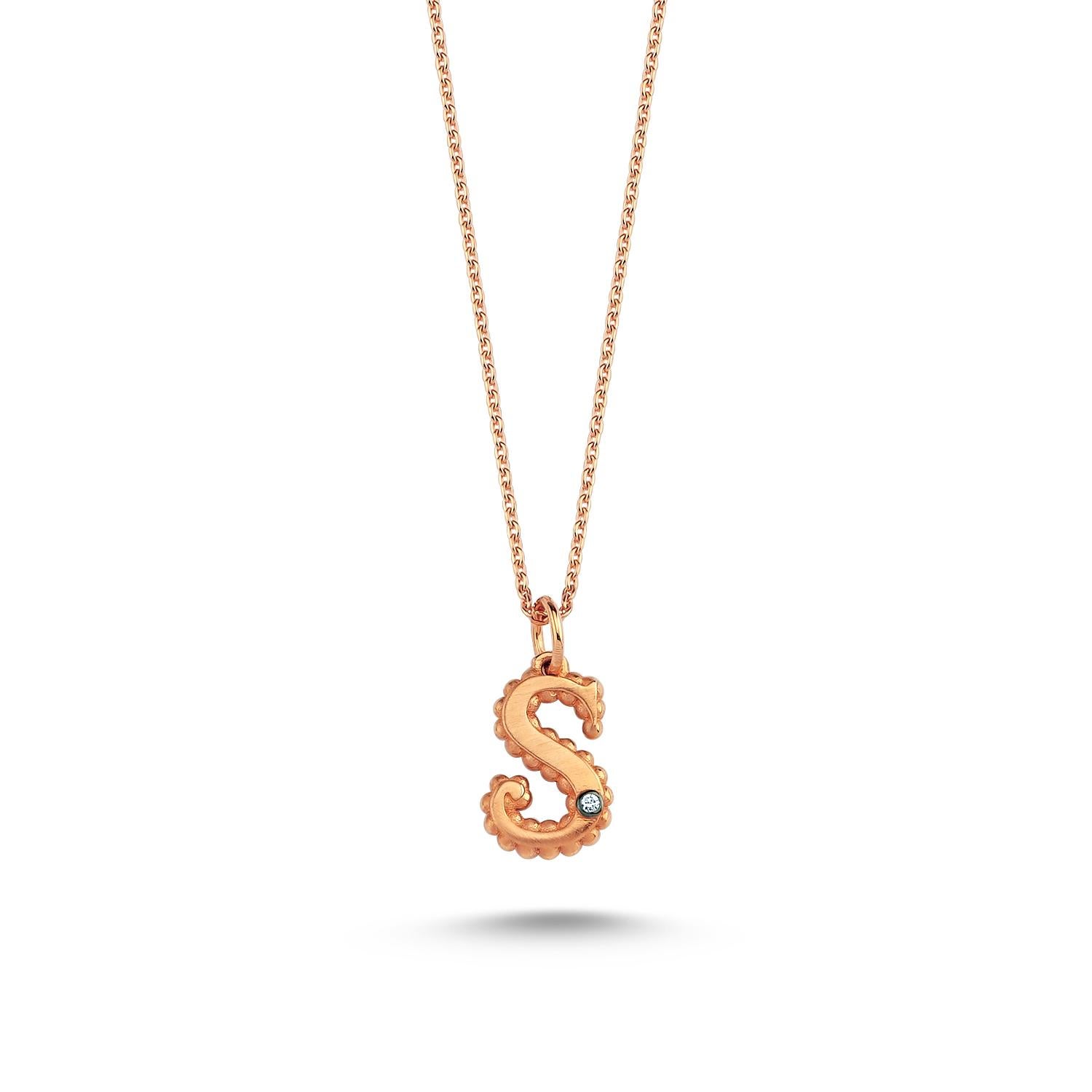 S large necklace in 14k rose gold with white diamond by Selda Jewellery

Additional Information:-
Collection: Letter collection
14K Rose gold
0.01ct White diamond
Pendant height 1cm
Chain length 44cm