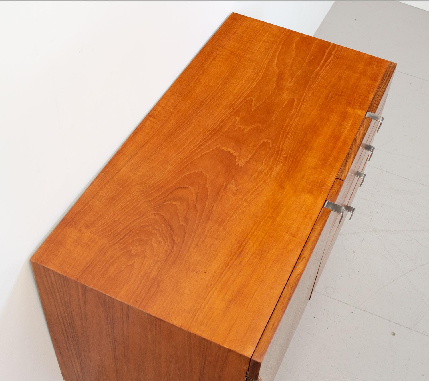 S Range teak sideboard designed by John and Sylvia Reid in 1959 for Stag. This iconic piece of British design features a beech lined interior, with nickel plated ‘L’ shaped recessed handles and ‘V’shaped legs. It comprises 4 drawers, the top one