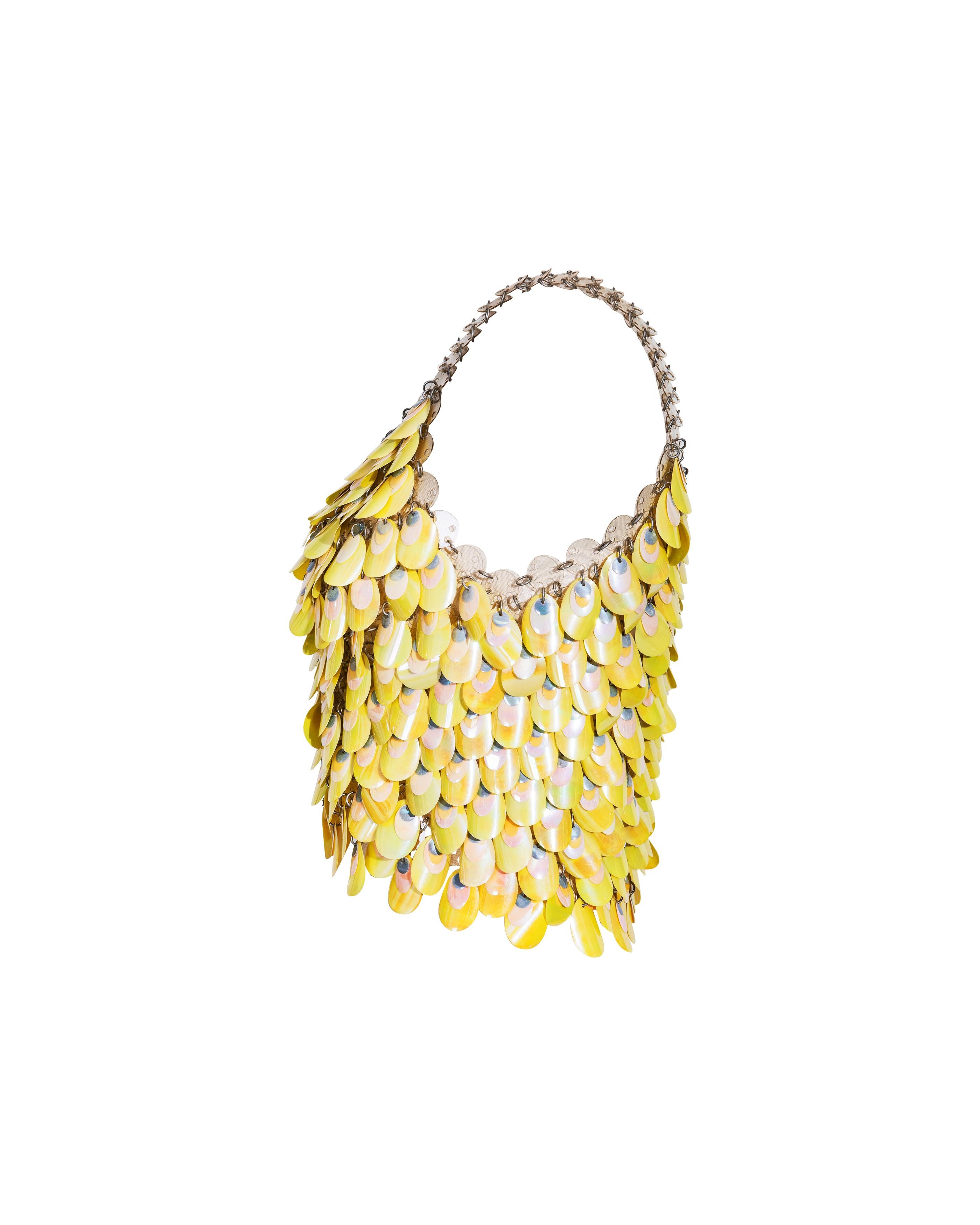 S/S 1967 Paco Rabanne yellow-green layered iridescent shell chainmail top. 3D layered shell-pattern discs of varying sizes on top of silver-tone chainmail base. Sleeveless v-neck tank top design. Dress version featured in Los Angeles County Museum