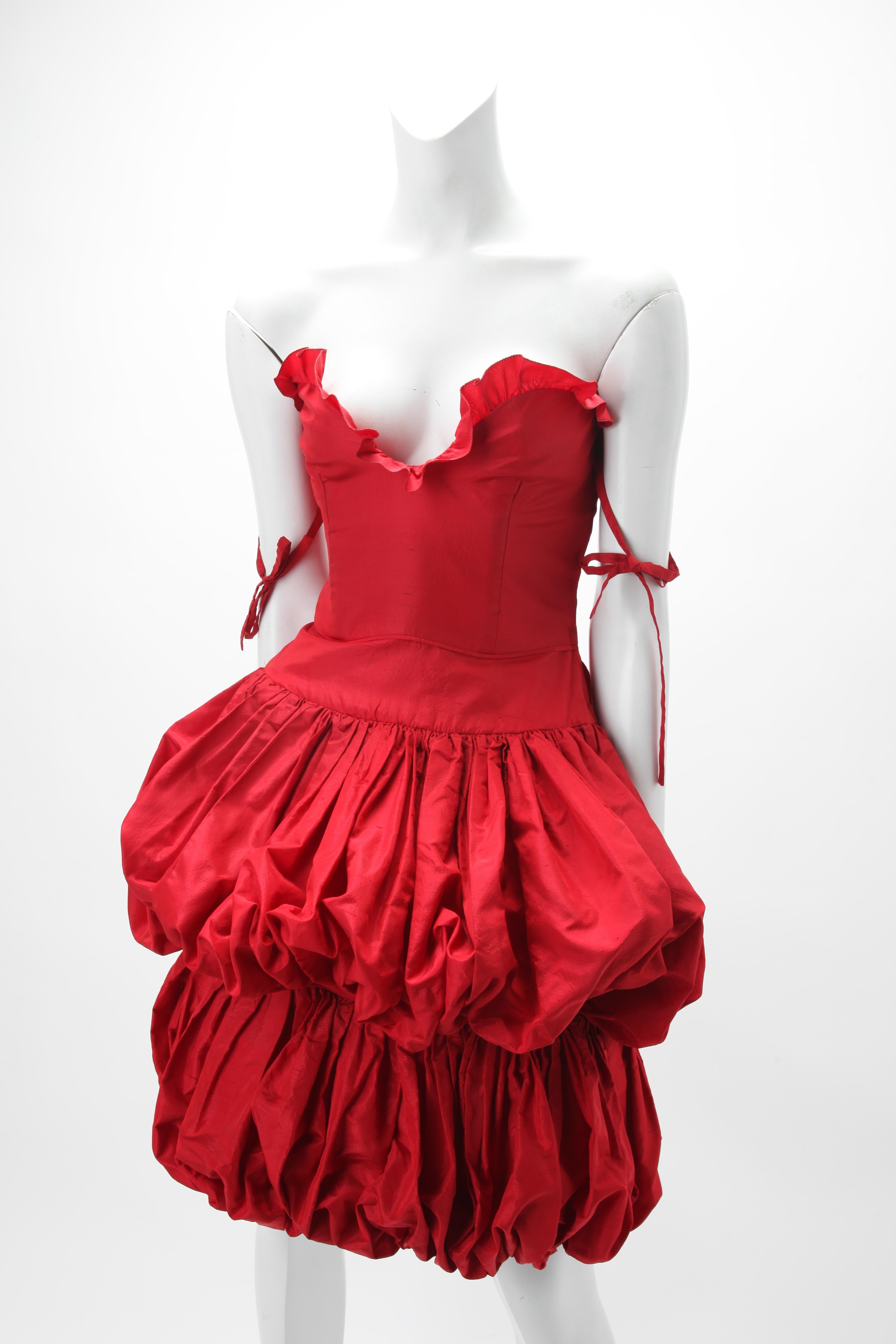 S/S 1982 Valentino Boutique Red Silk Balloon-Shaped Cocktail Dress; Fitted Strapless Bodice with Ruffle Trim; Off the Shoulder Self Ties. Size small, Fits US size 2-4 
Inspired by Chinese Lantern Bloomers and Bubble Skirts.
