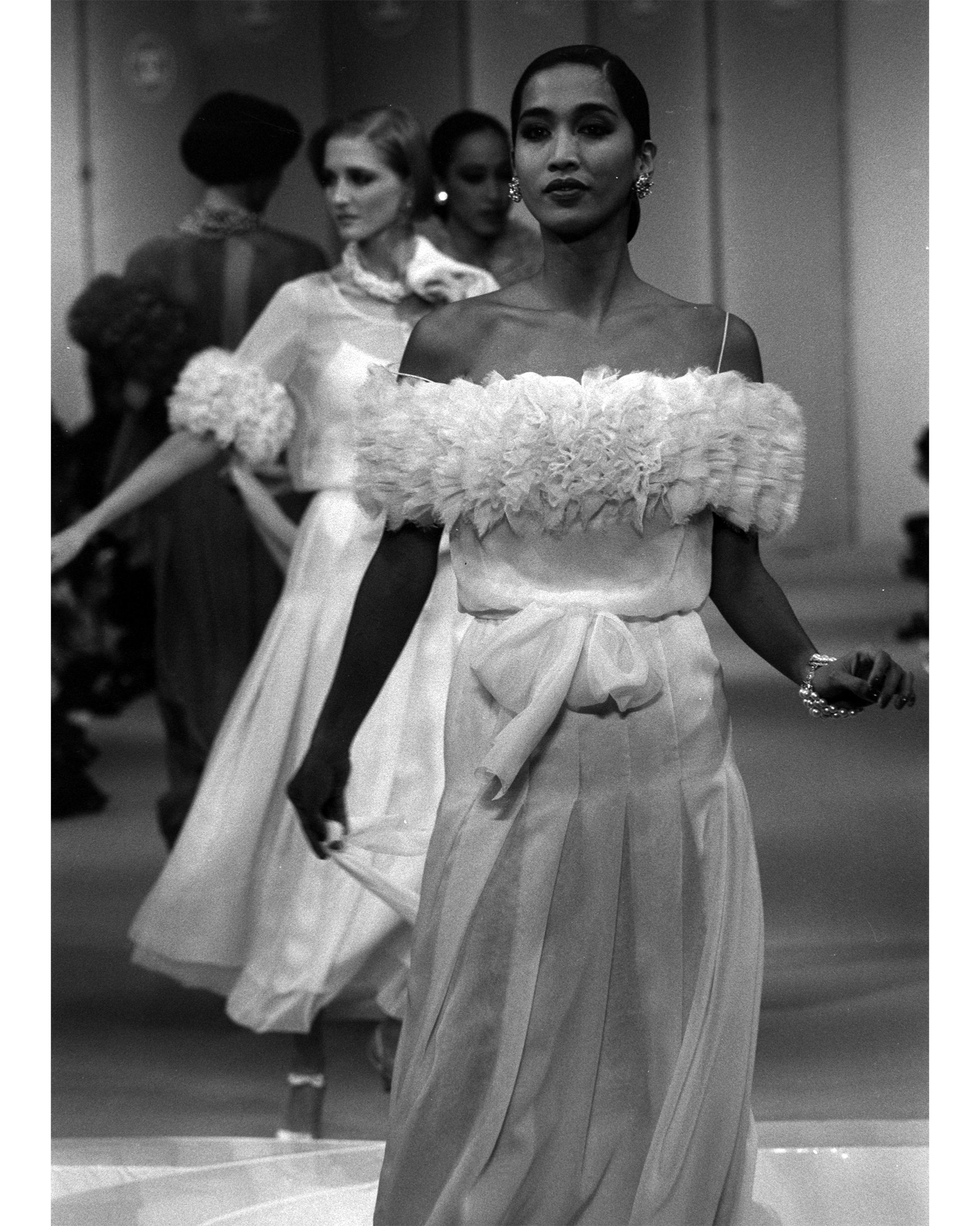 S/S 1984 Chanel by Karl Lagerfeld butter yellow silk chiffon gown with fabric front button closures and layered full short sleeves. Upper features built-in spaghetti strap slip dress with semi-sheer silk chiffon drop waist overlay, with concealed