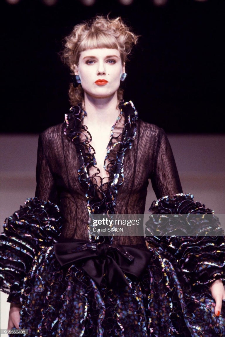 TheRealList presents: an incredible black and multicolor Paco Rabanne Haute Couture gown. From the Spring/Summer 1987 collection, this fabulous gown debuted on the season's Haute Couture runway. The dress is constructed of light sheer black lace and