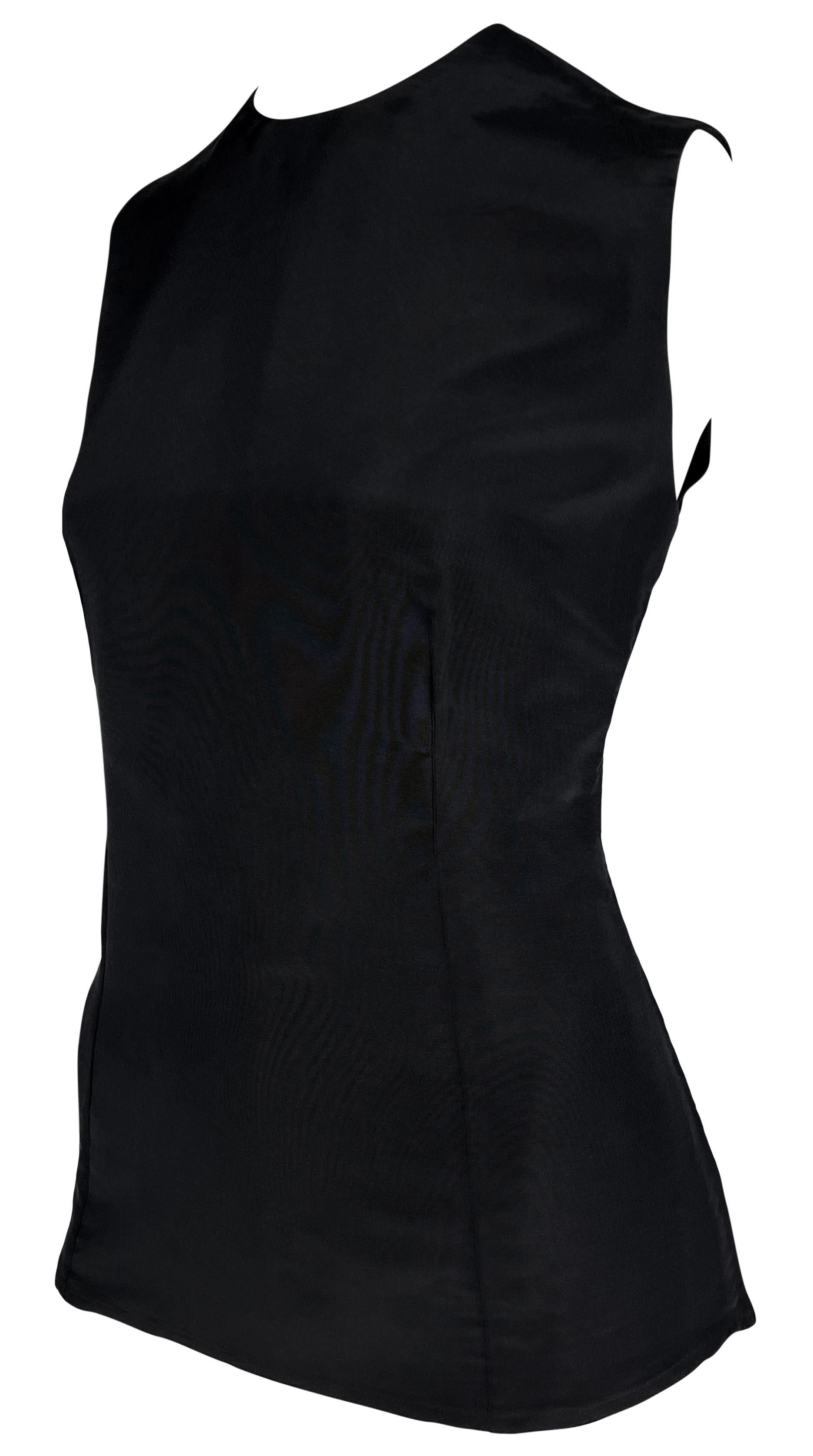From the Spring/Summer 1990 collection, this Gianni Versace black silk sleeveless top is the perfect elevated essential. 

Approximate measurements:
Size - 42IT
Shoulder to hem: 24