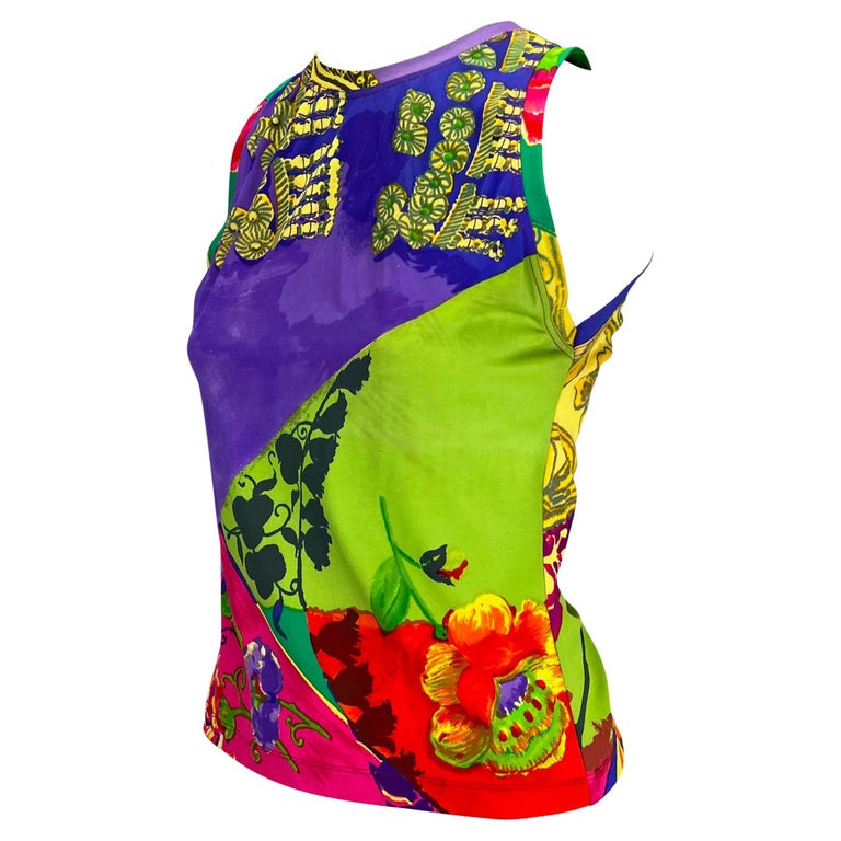 TheRealList presents: a multicolored Gianni Versace swim top, designed by Gianni Versace. From the Spring/Summer 1990 collection, this stretchy sleeveless pool shirt features color-blocked panels filled with colorful floral baroque details. 

Follow