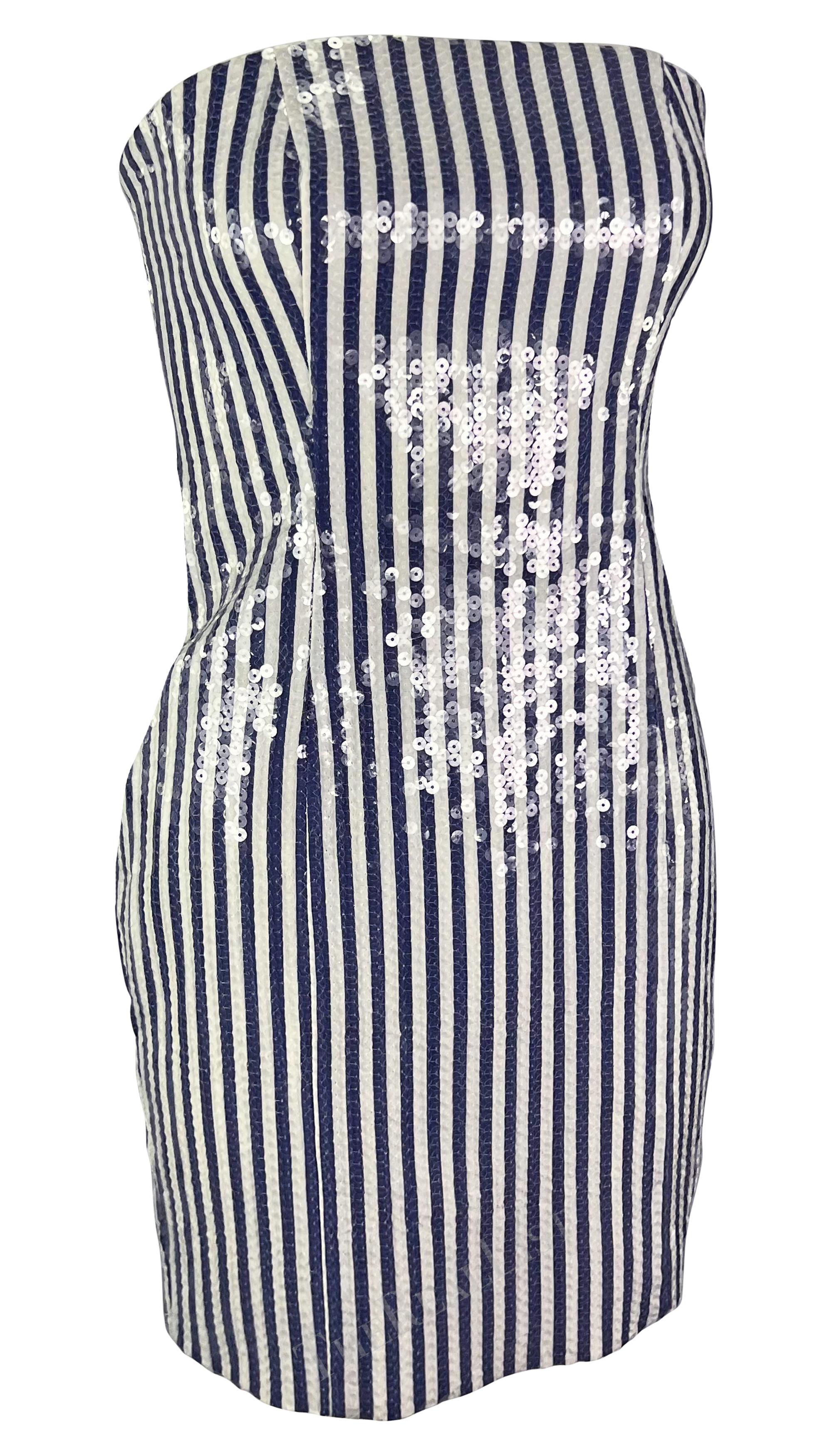Presenting an incredible blue and white striped Michael Kors strapless mini dress. From the Spring/Summer 1990 collection, a nearly identical version of this mini dress debuted on the season's runway. The dress features a vertical blue and white