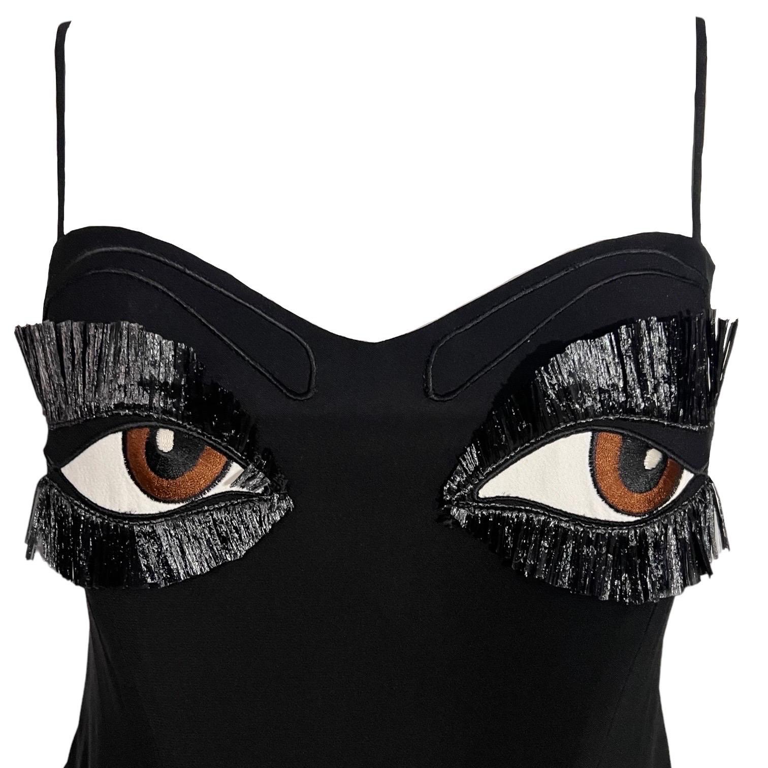 Moschino Couture Vintage rare black bustier top from the Spring Summer 1990 collection. Fun whimsical bustier embroidered with eyes, eyebrows and fringe for eyelashes.
Made in Italy
54% acetate, 46% rayon

Size: US size 8. Refer to the measurements
