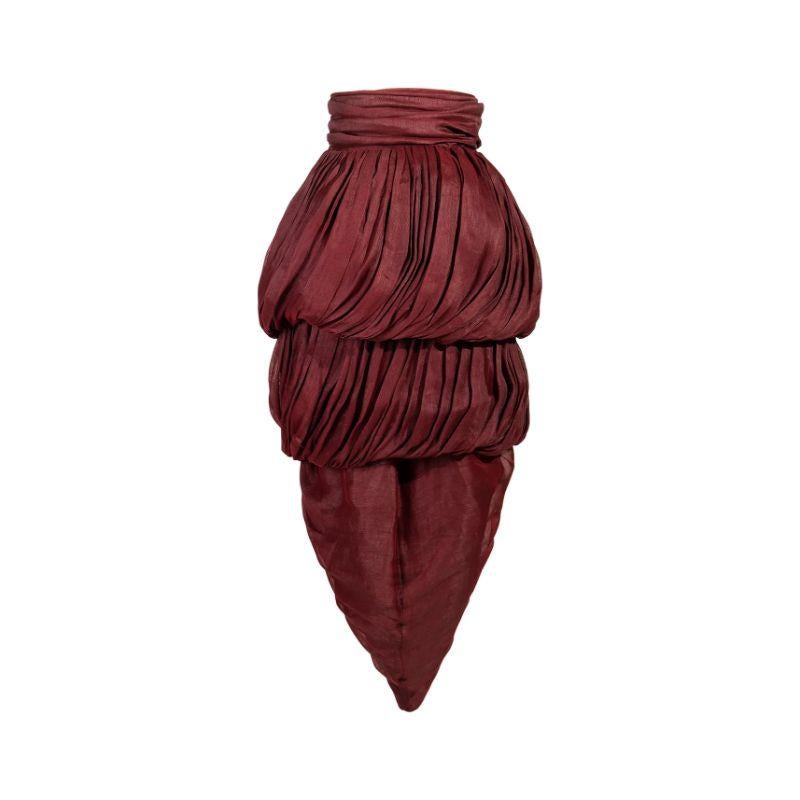 S/S 1990 Romeo Gigli textured burgundy layered skirt with tie at waist. Draped linen blend 3-tiered midi skirt with original tags. Button side closures. As seen on the runway.

Additional information:
Best fits size US 4.
Waist: 13.3