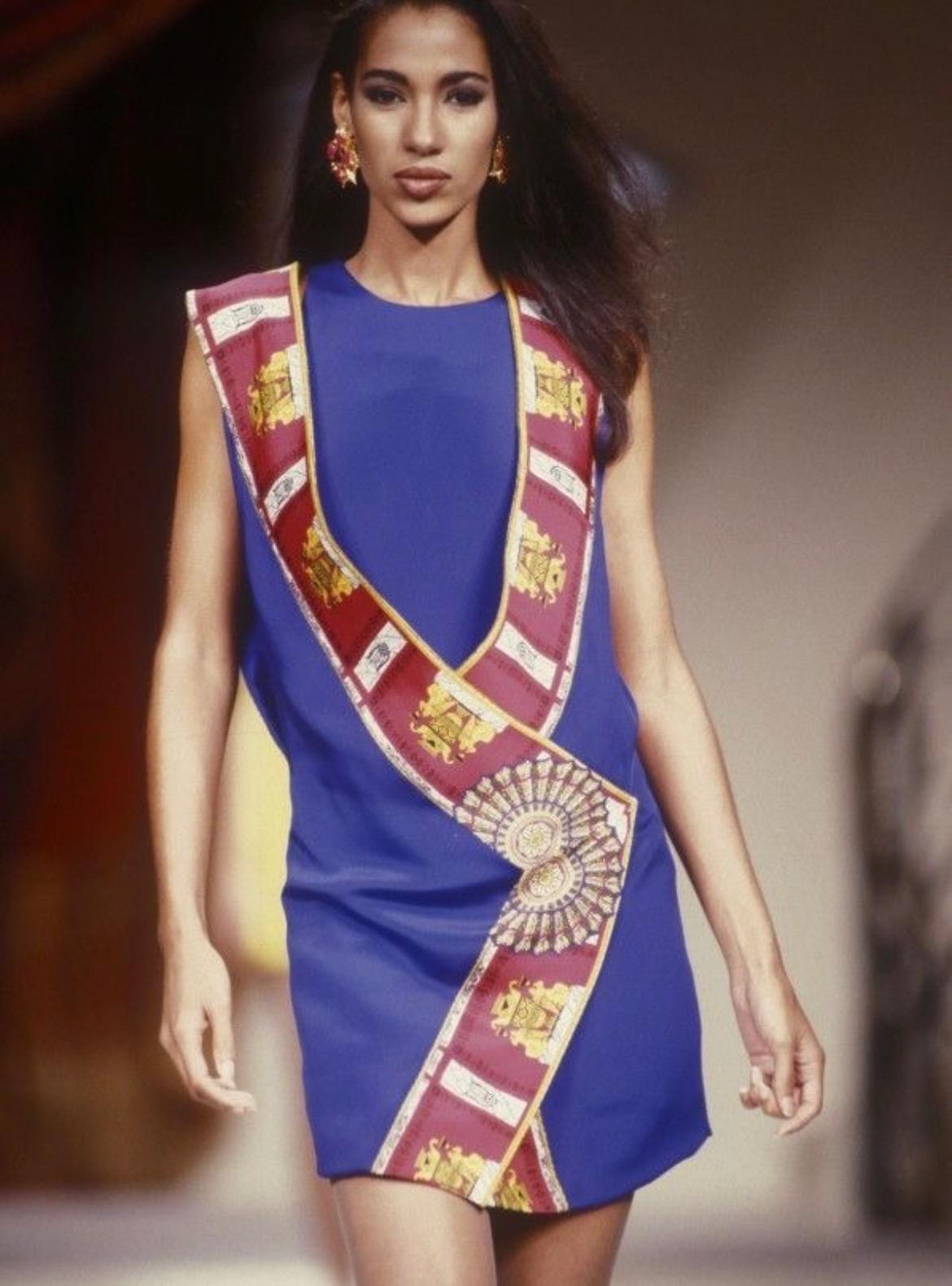 Presenting a stunning Atelier Versace dress set from the S/S 1991 collection, designed by Gianni Versace. This extraordinary piece can be seen on the season's haute couture runway. Comprised of two pieces, the body of the dress is made of a simple