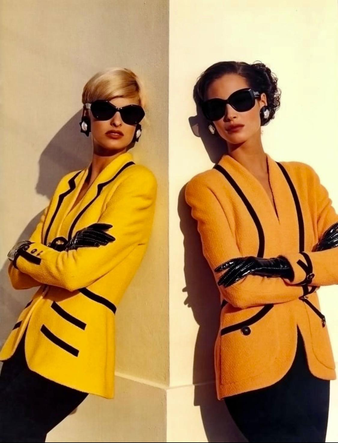 Presenting a bright yellow tweed Chanel skirt suit, designed by Karl Lagerfeld. The classic set was created as part of Karl's S/S 1991 collection and was notably worn by Linda Evangelista for that season's campaign. The blazer with a similar skirt