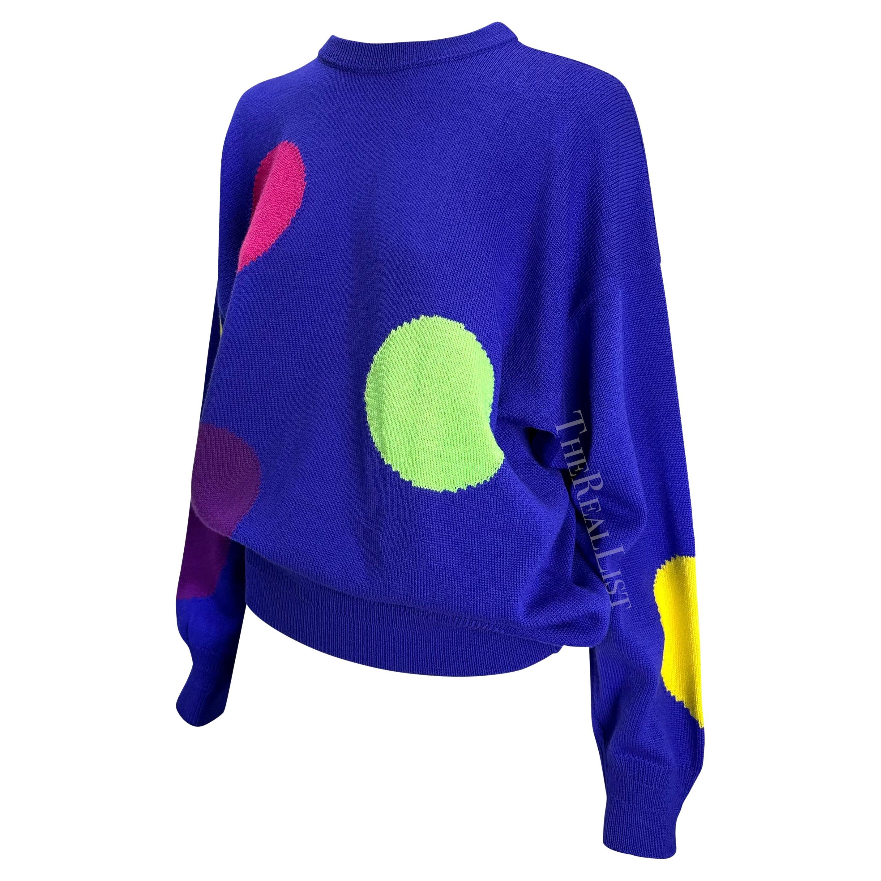 TheRealList presents: a vibrant blue Gianni Versace polka dot sweater, designed by Gianni Versace. From the Spring/Summer 1991 men's collection, this oversized sweater is covered in a number of large colored polka dots. 

Follow us on Instagram!