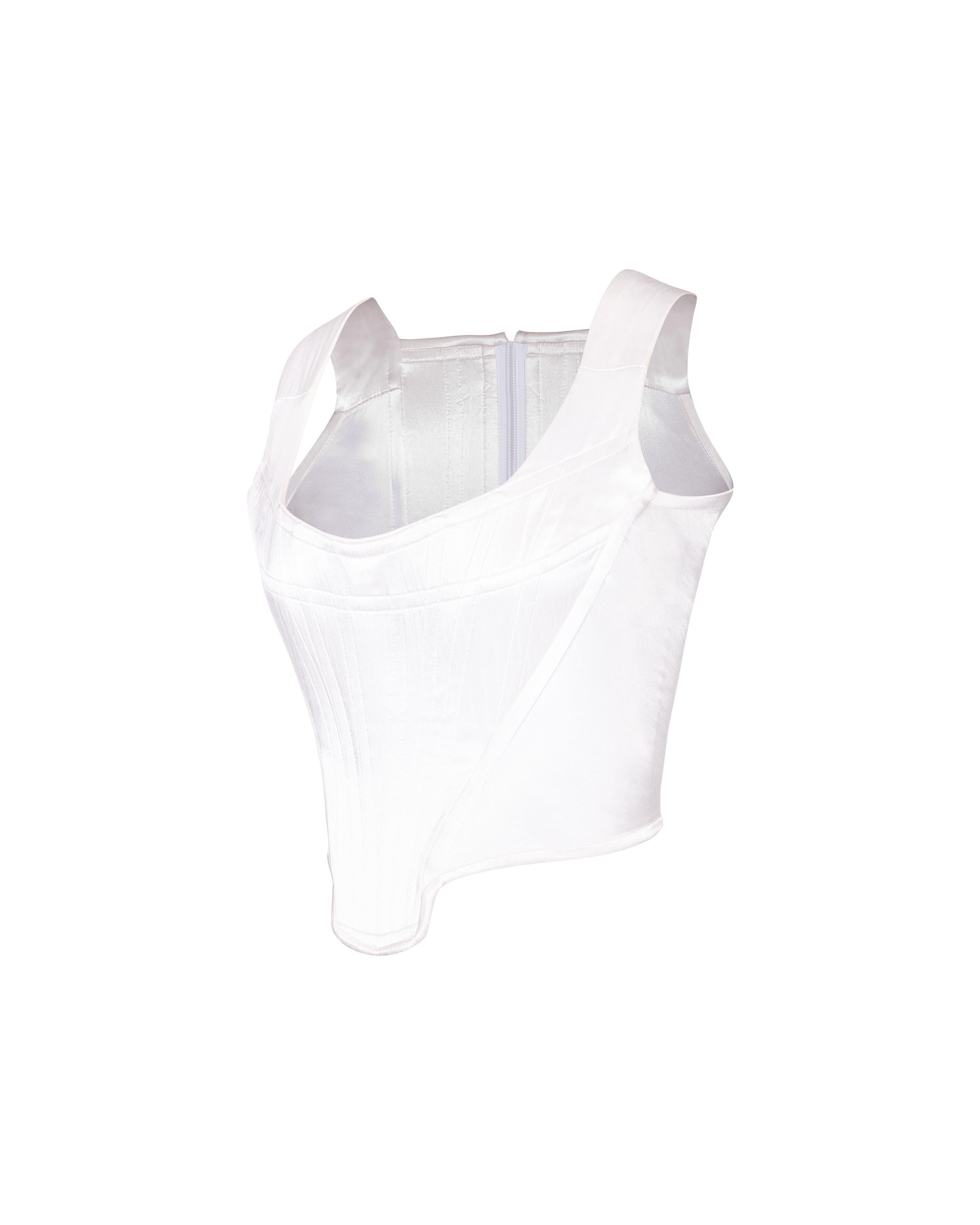 S/S 1991 Vivienne Westwood white satin corset. Boned cotton corset with moderate stretch throughout sides and slight satin finish. Center back zip closure. In very good vintage condition with light wear throughout, including slight pilling